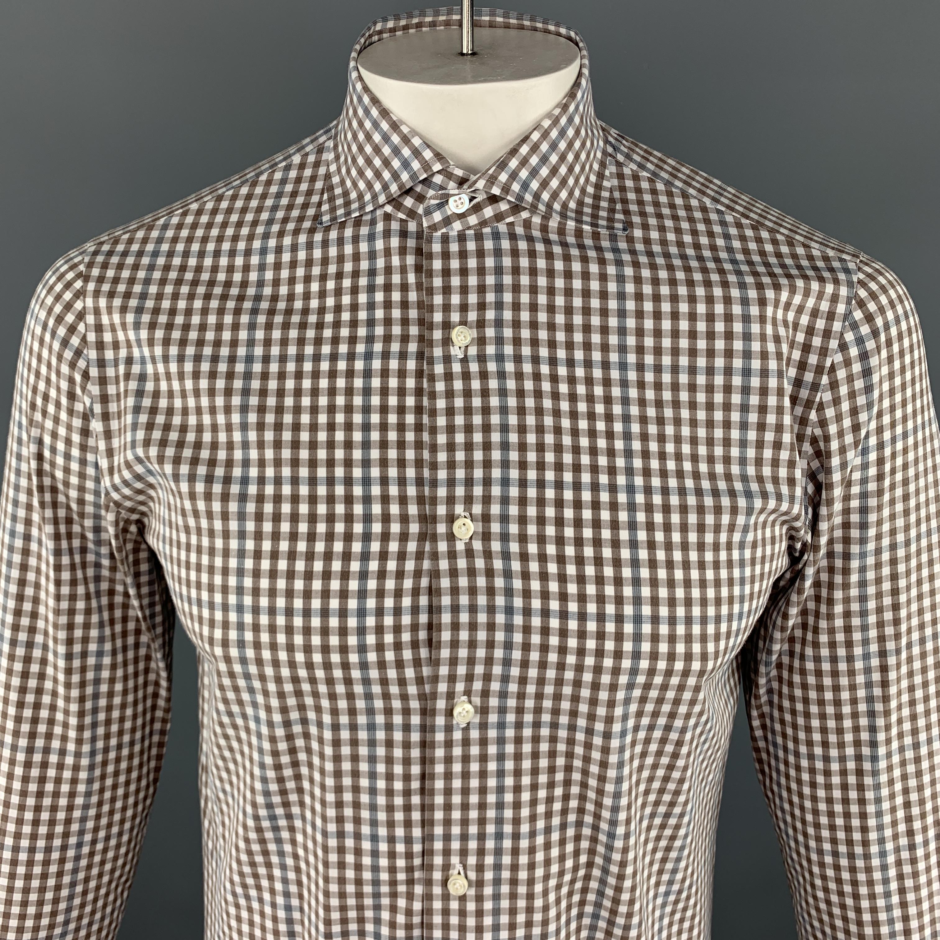 ISAIA  Long Sleeve Shirt comes in brown and white tones in a plaid cotton material, with a spread collar, buttoned cuffs, button up. Made in Italy.

Excellent Pre-Owned Condition.
 Marked: IT 39

Measurements:

Shoulder: 15.5 in. 
Chest: 42 in.