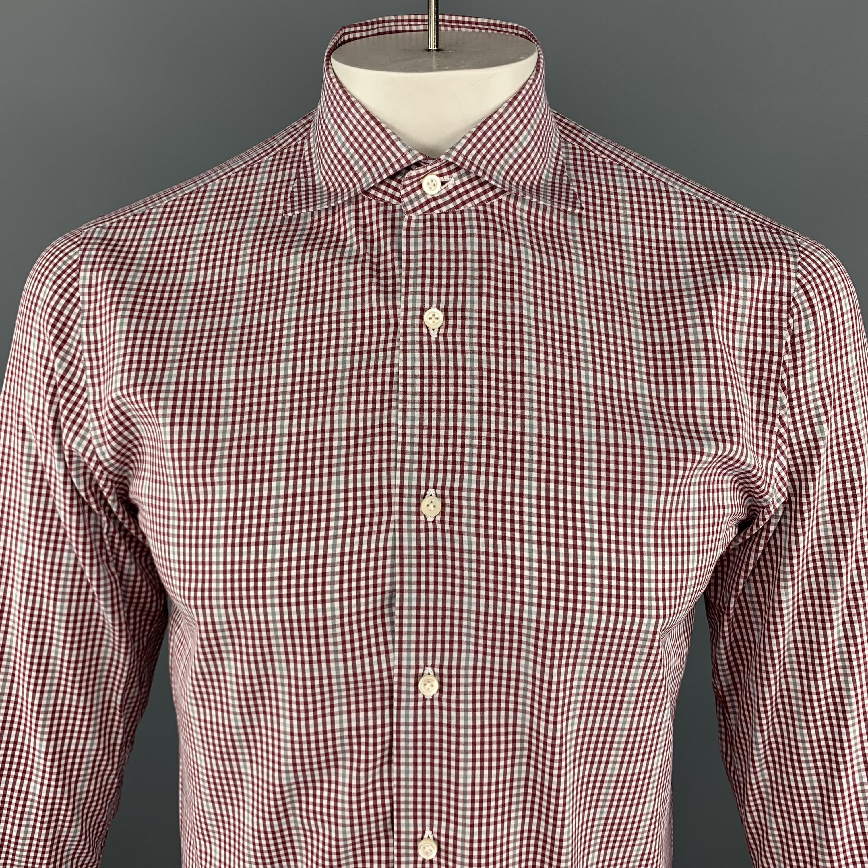 ISAIA Long Sleeve Shirt comes in burgundy and white tones in a plaid cotton material, with a spread collar, buttoned cuffs, button up. Made in Italy.

Excellent Pre-Owned Condition.
Marked: IT 39

Measurements:

Shoulder: 16 in. 
Chest: 41 in.