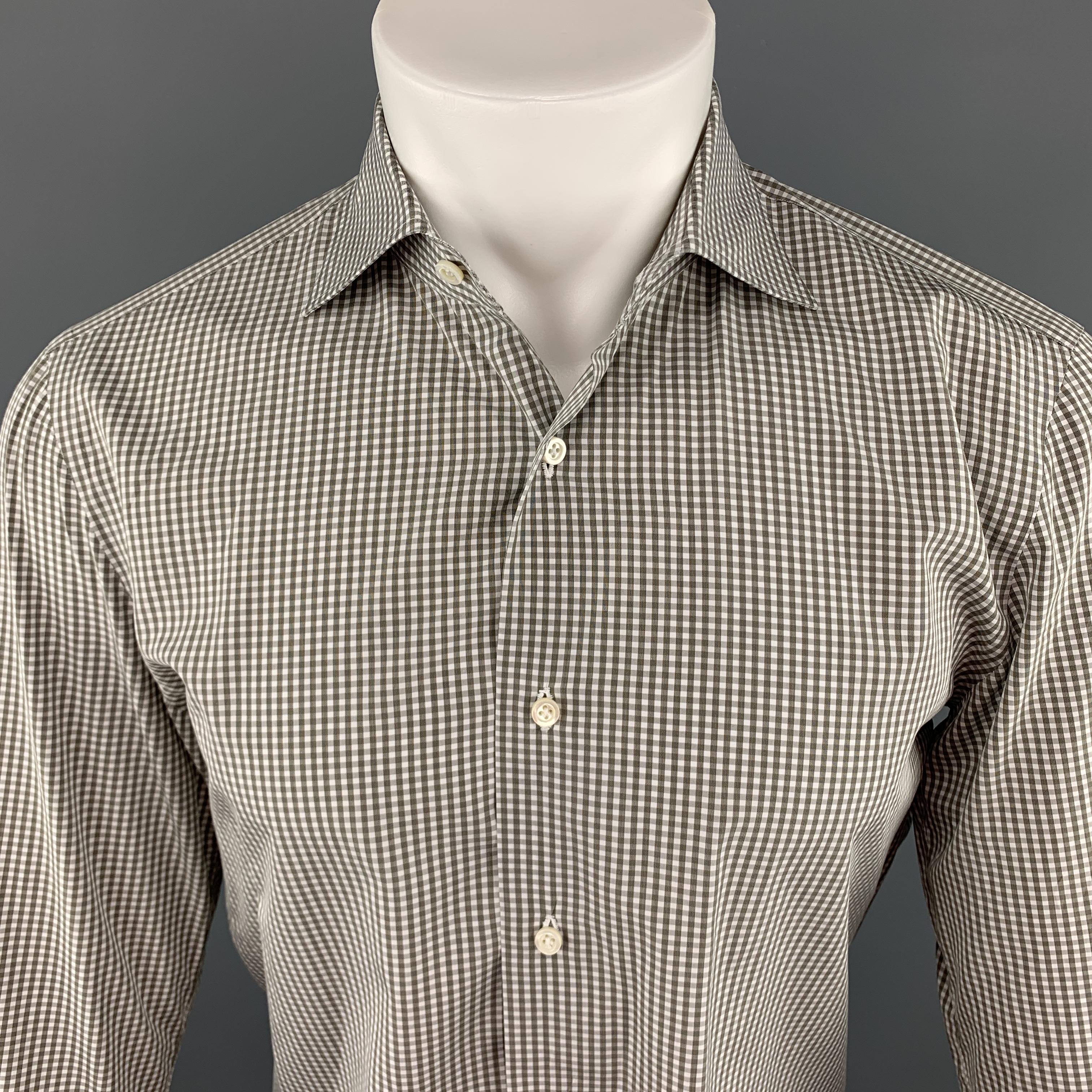 ISAIA Long Sleeve Shirt comes in white and olive tones in a checkered cotton material, with a  spread collar, buttoned cuffs, button up. Made in Italy.

Excellent Pre-Owned Condition.
 Marked: IT 39

Measurements:

Shoulder: 16 in. 
Chest: 42 in.