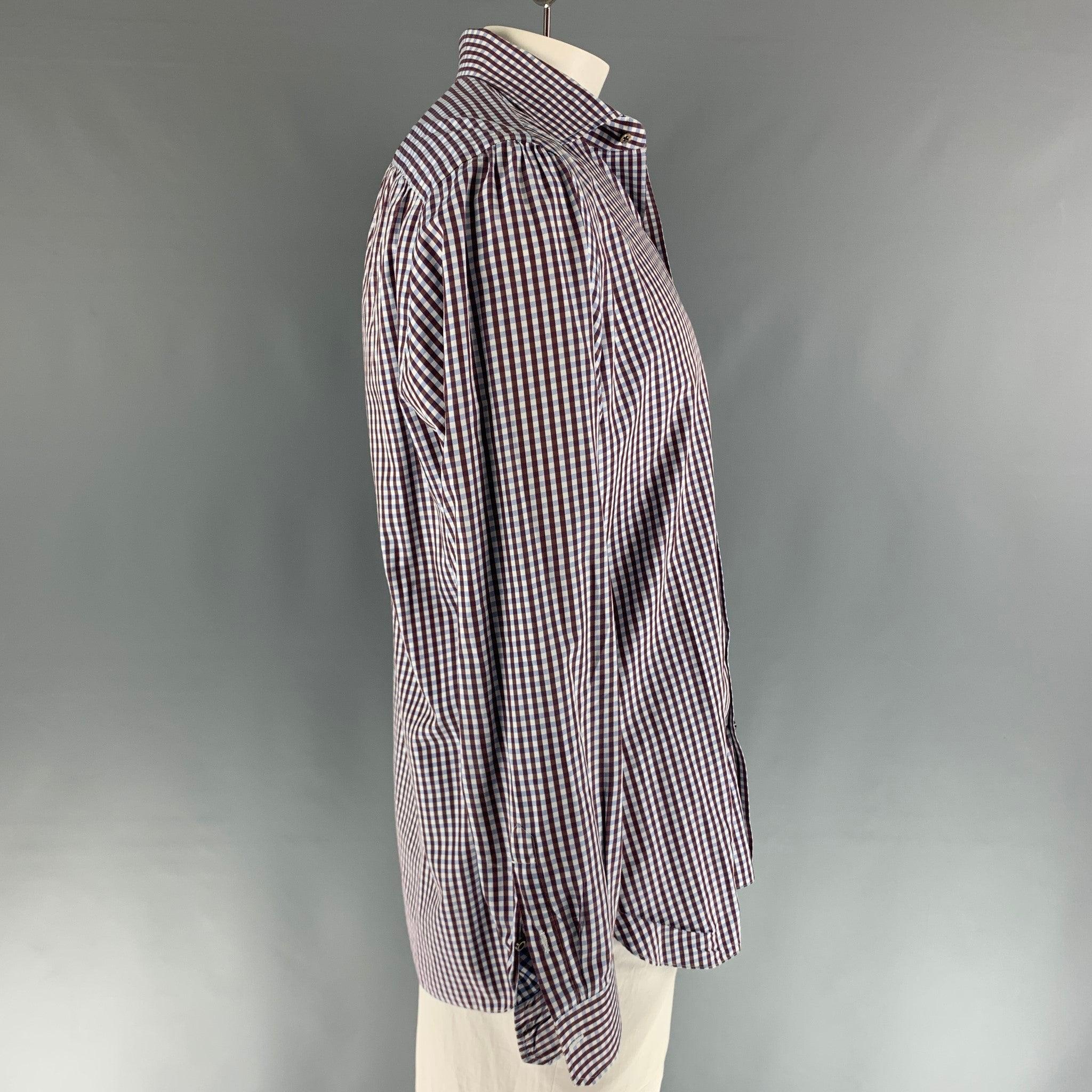 ISAIA long sleeve button down shirt features a brown and blue checkered design and a spread collar. 100% cotton. Made in Italy.
Very Good Pre-Owned Condition. 

Marked:   43 & 17
 

Measurements: 
  
Shoulder: 19 inches Chest: 48 inches Sleeve: 26.5