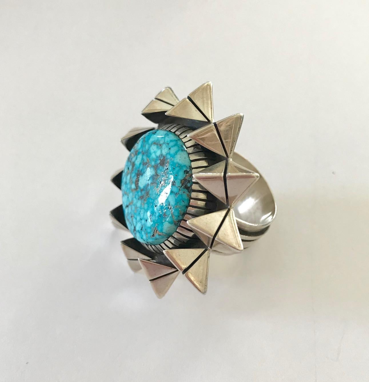 A turquoise and sterling silver ring, by Native American artist Isaiah Ortiz, San Felipe Pueblo. Stamped Isaiah, Sterling. 
The ring is a size 9. This ring can be sized down and can be sized up a half size. 
Jewelry by Isaiah Ortiz (b. 1976) is