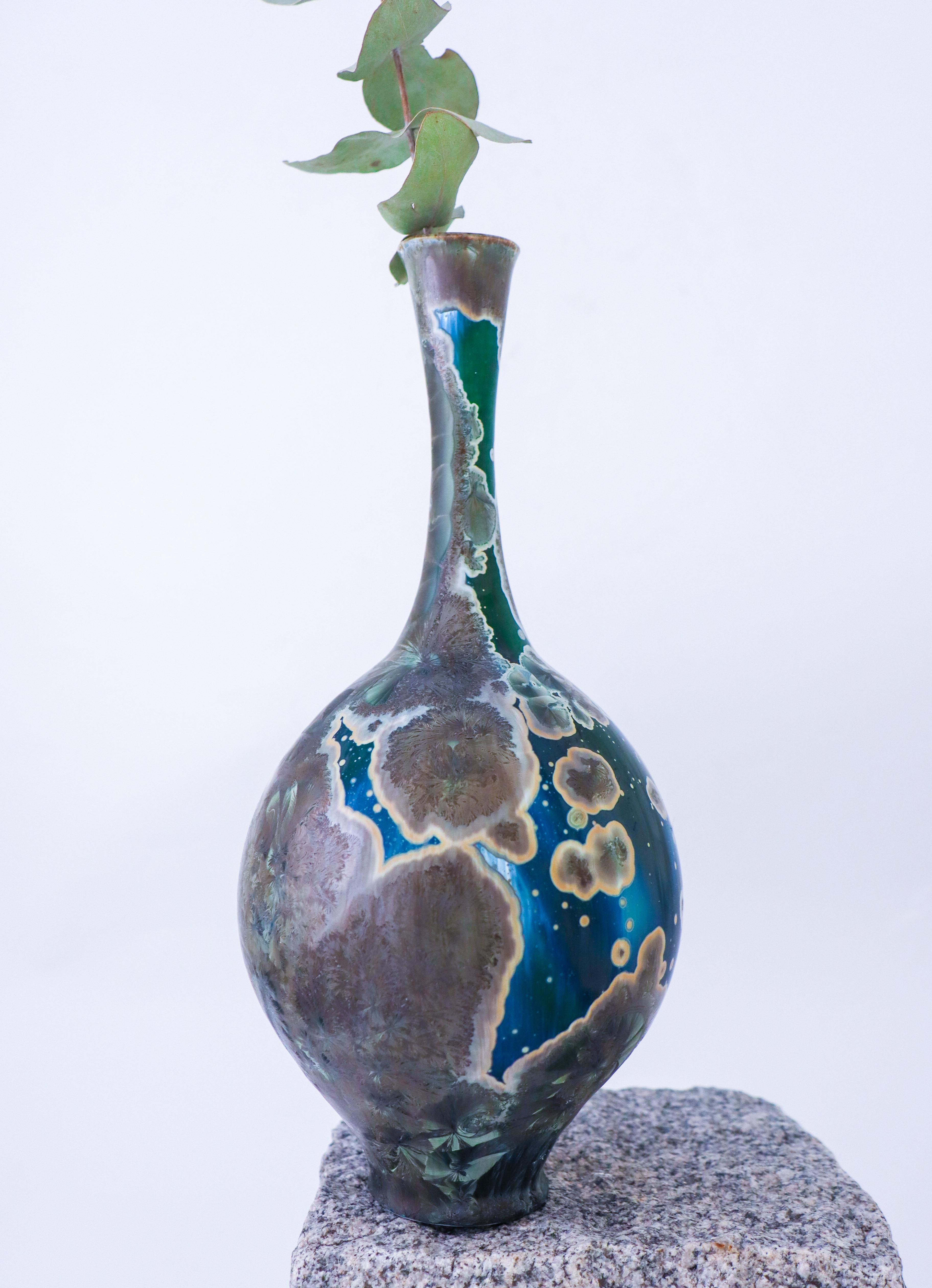 A blue & green vase with a stunning crystalline glaze designed by Isak Isaksson in Sweden. The vase is 30 cm (12