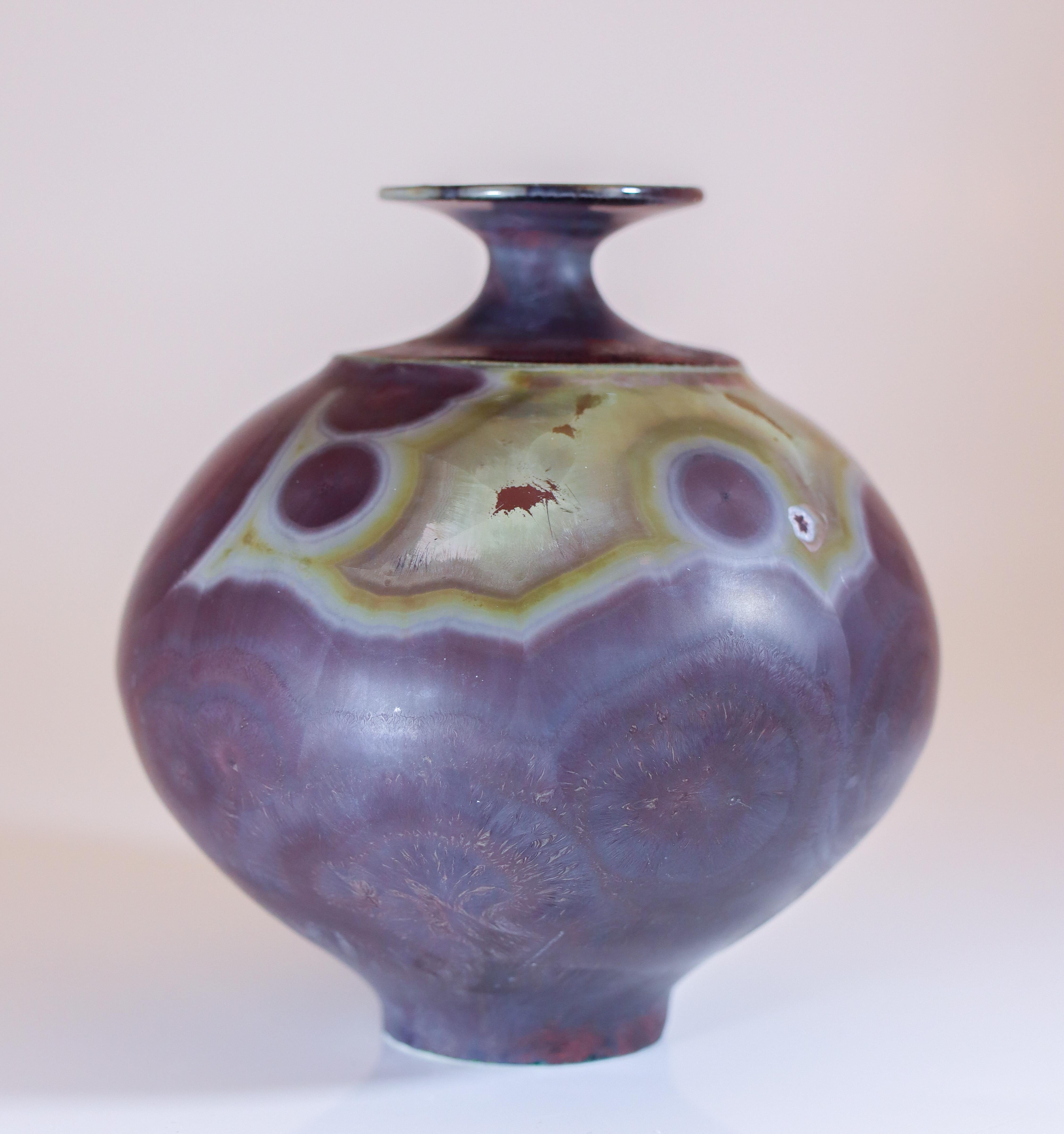 A purple vase with a stunning matte crystalline glaze designed by Isak Isaksson in Sweden. The vase is 11 cm (4.4