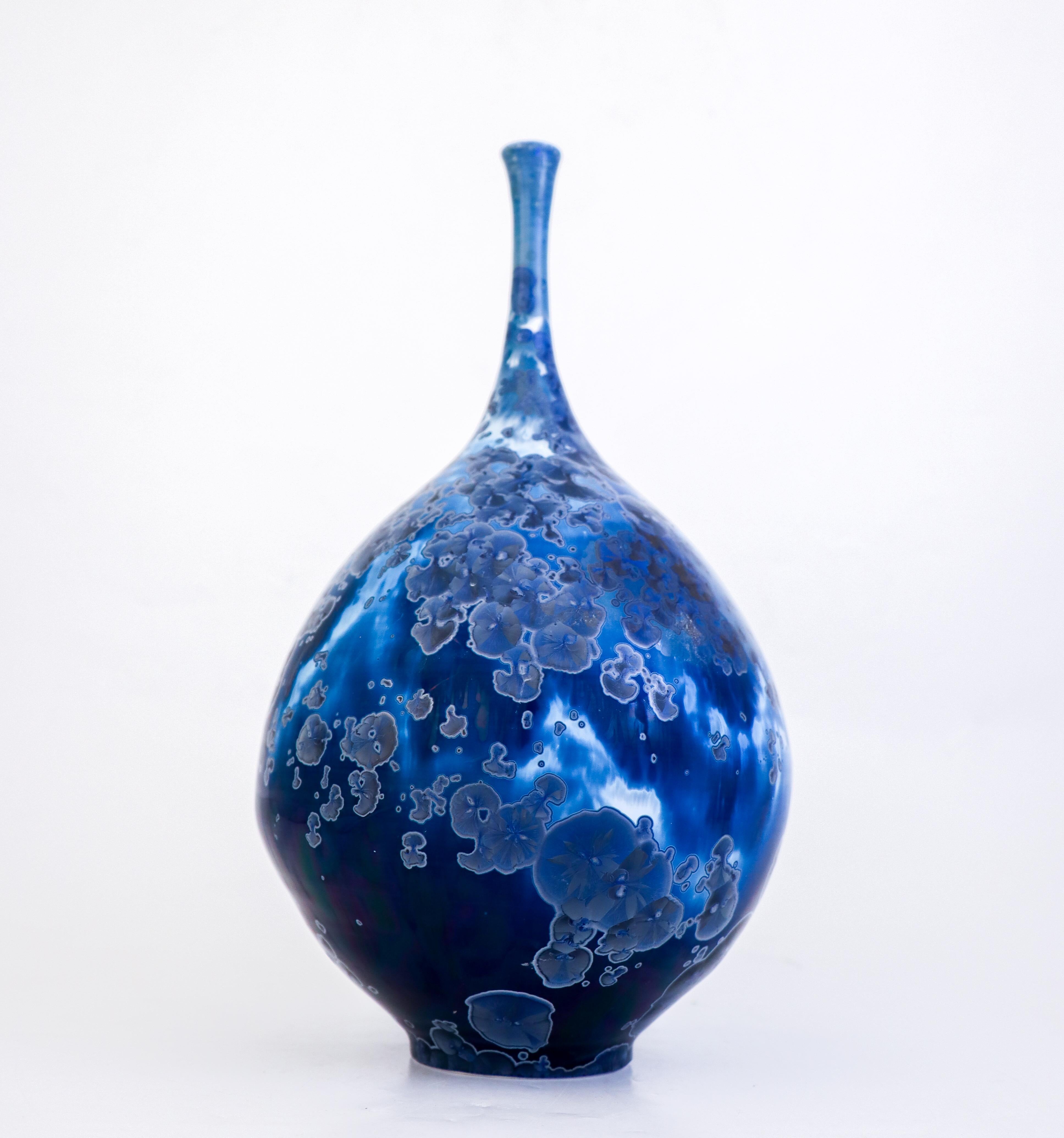 A large lovely blue vase with a lovely crystalline glaze in silver designed by Isak Isaksson in Sweden. The vase is 30.5 cm (12.2