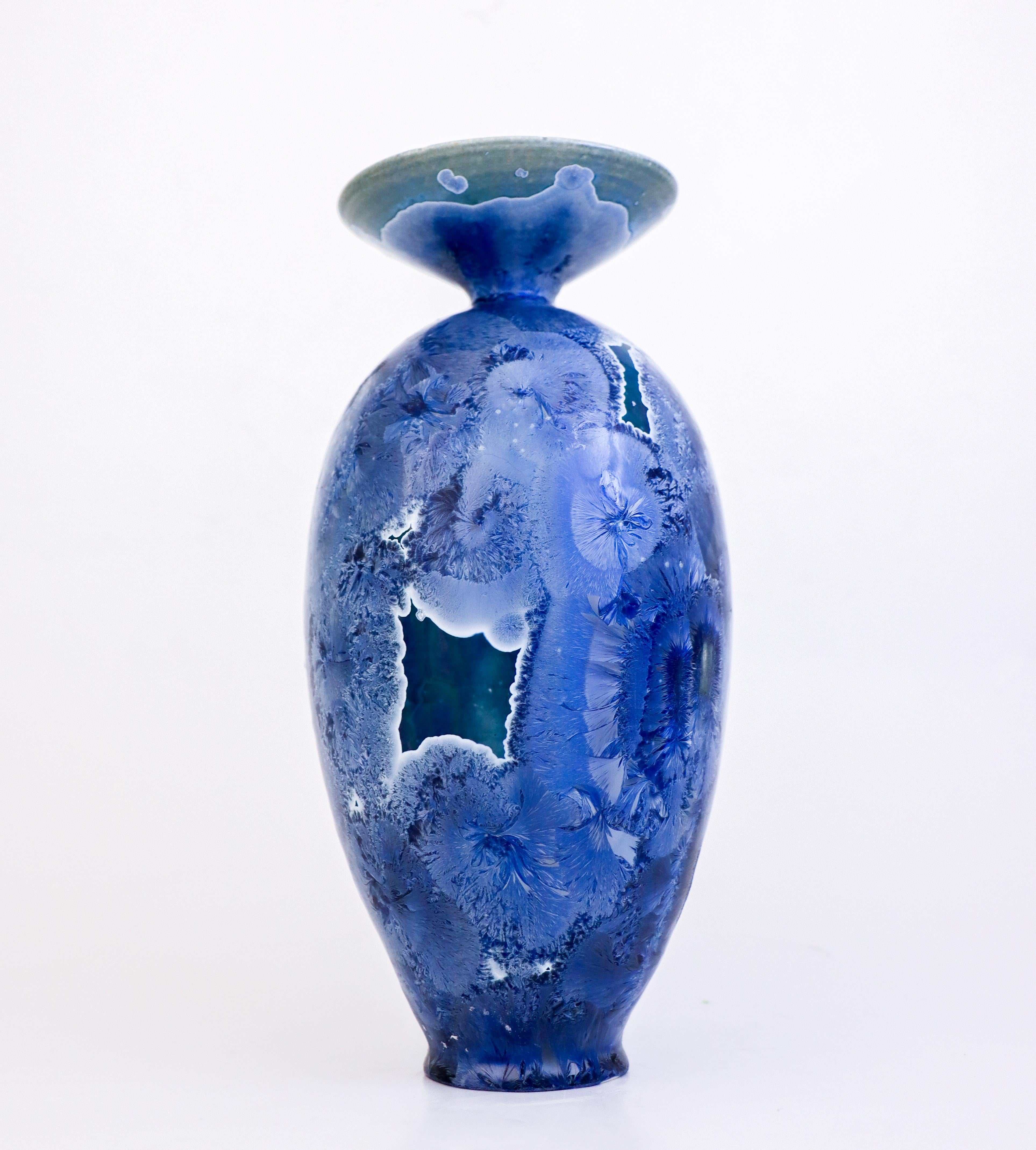 A large lovely blue vase with a stunning crystalline glaze designed by Isak Isaksson in Sweden. The vase is 25.5 cm (10.2