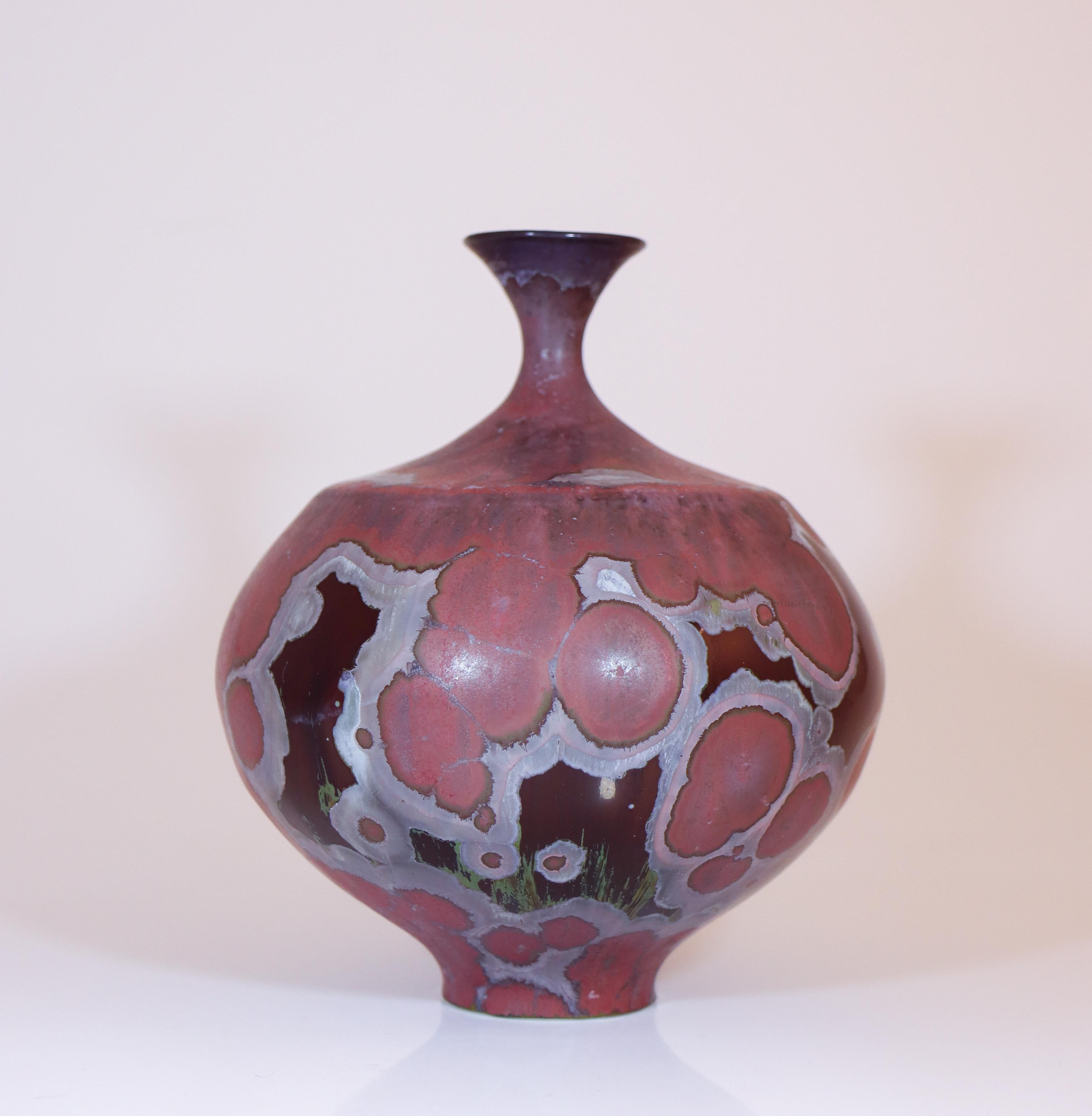 A purple vase with a crystalline glaze designed by Isak Isaksson in Sweden. The vase is 15.5 cm (6.2