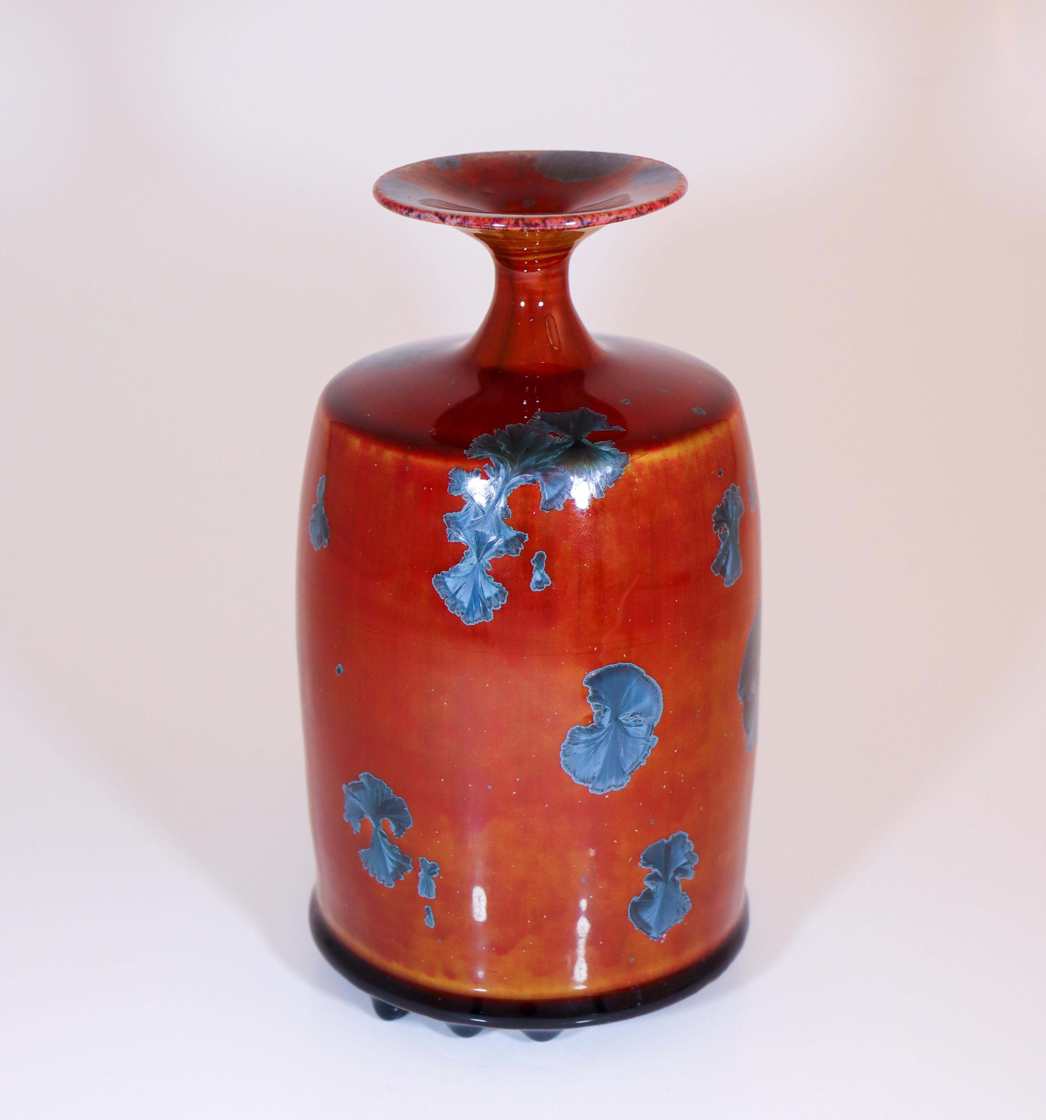 A red vase with a crystalline glaze designed by Isak Isaksson in Sweden. The vase is 18.5 cm (7.4