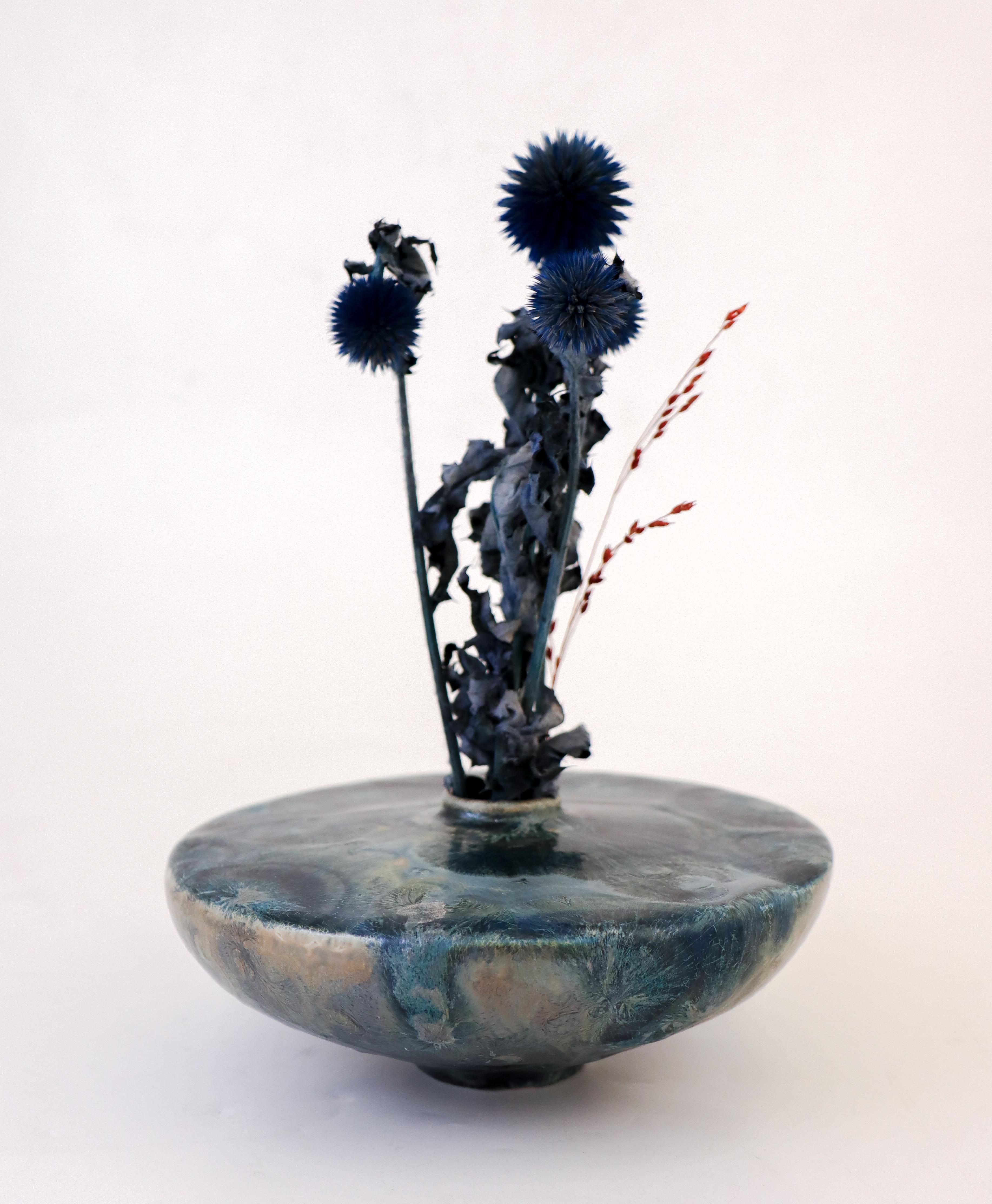Just a stunning metallic blue low vase with a lovely crystalline glaze designed by Isak Isaksson in Sweden. The vase is 6 cm (2.4