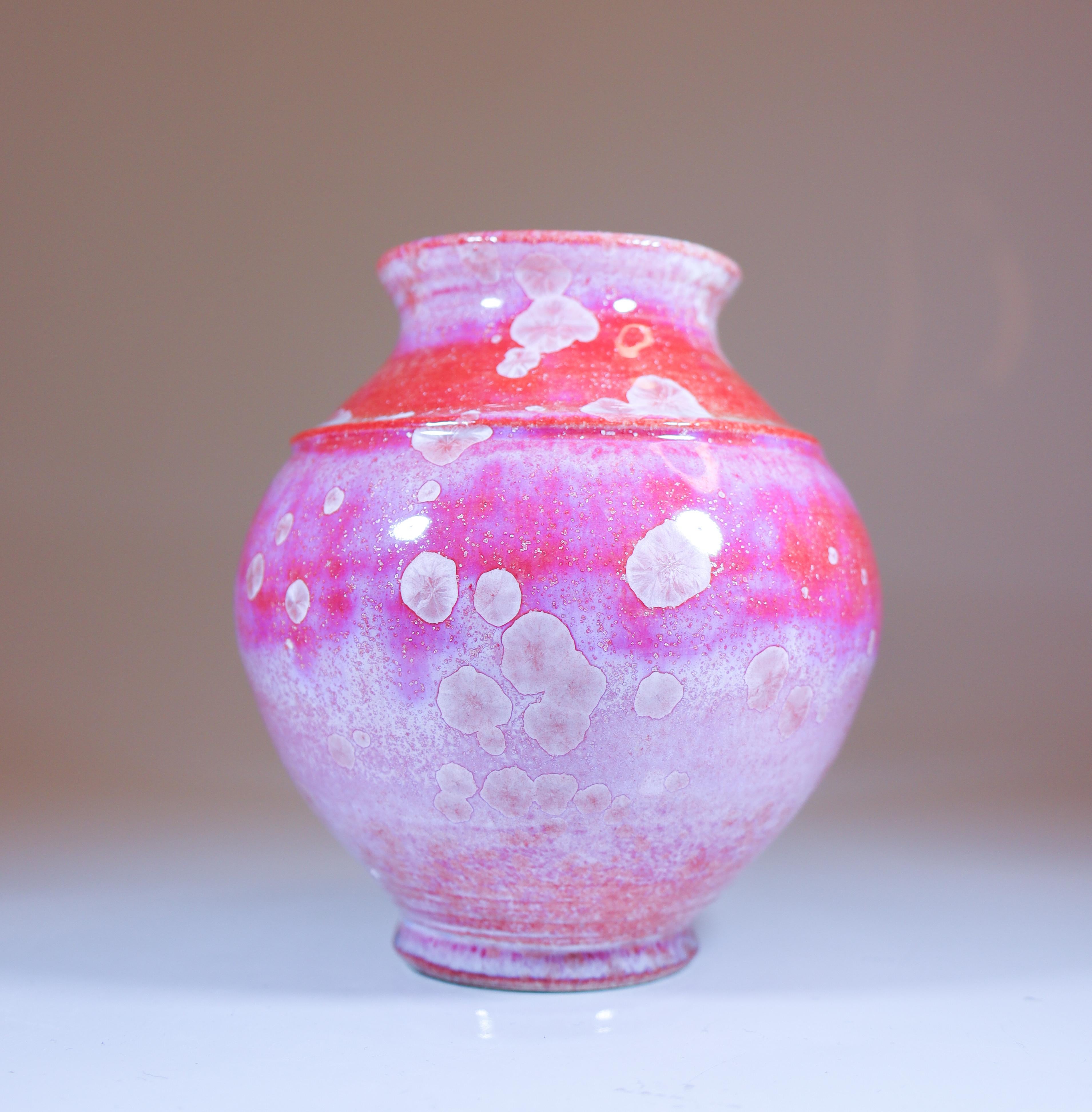 A pink vase with a lovely crystalline glaze designed by Isak Isaksson in Sweden. The vase is 11.5 cm (4.6