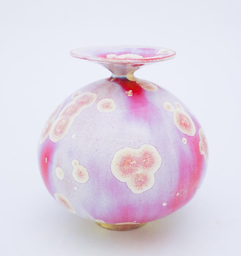 A unique vase in a pink-tone with a lovely crystalline glaze designed by the contemporary Swedish artist Isak Isaksson in his own studio. The vase is 15.5 cm (6.2