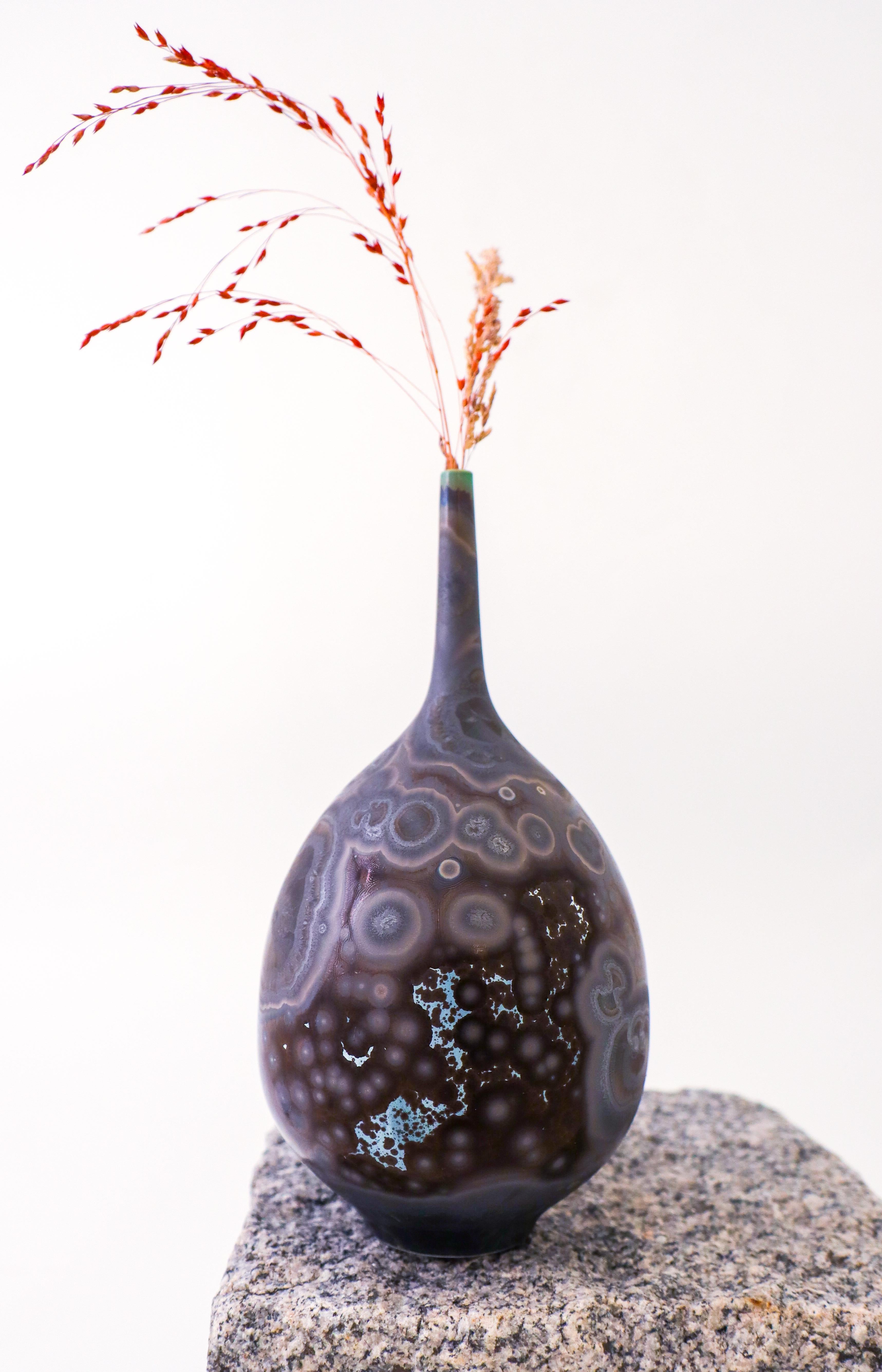A purple & brown vase with a lovely crystalline glaze designed by Isak Isaksson in Sweden. The vase is 18.5 cm (7.4