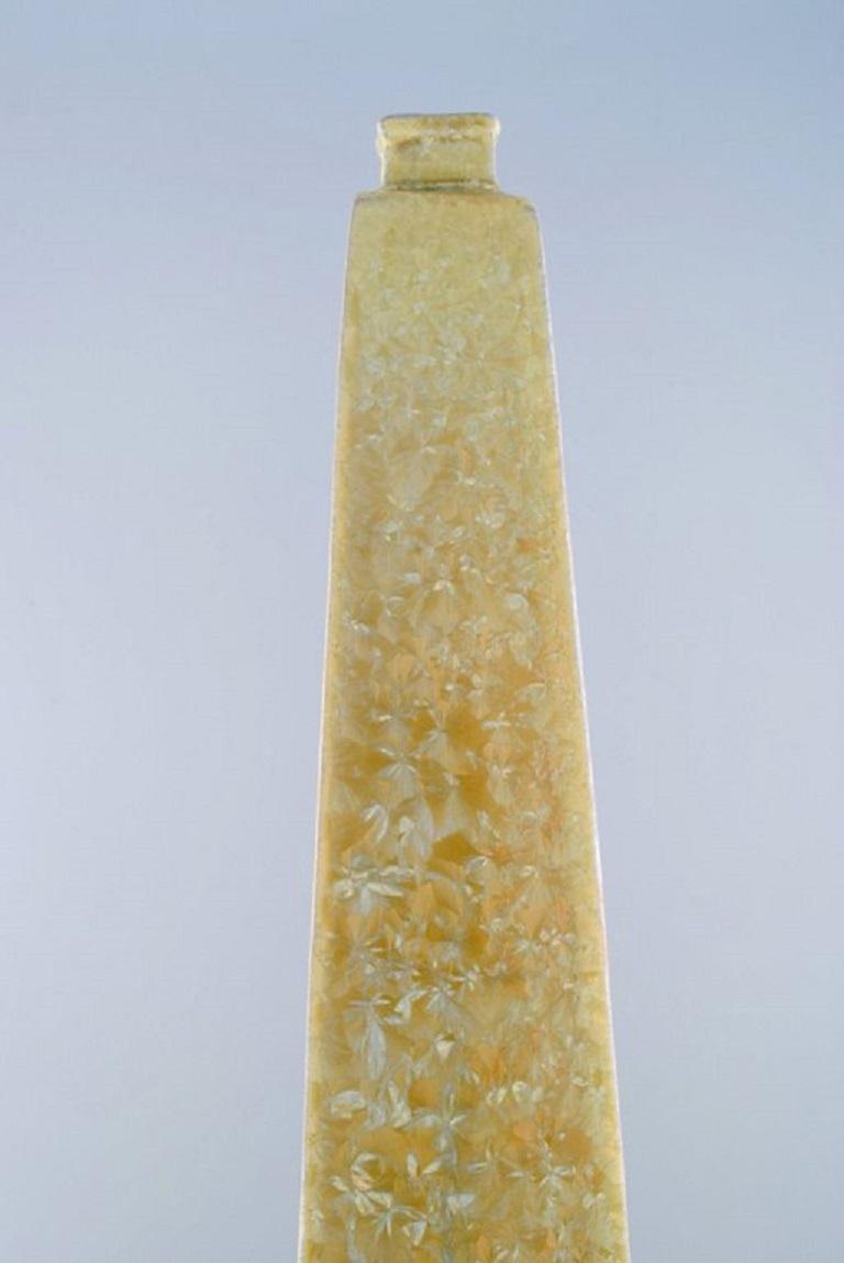 Isak Isaksson, Swedish ceramicist. Colossal unique vase in glazed ceramics. 
Beautiful crystal glaze in delicate yellow shades. 
Late 20th century.
Measures: 67.5 x 14 cm.
In excellent condition.
Signed.