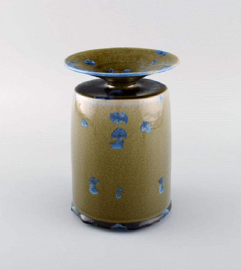 Isak Isaksson, Swedish ceramicist. Unique vase in glazed ceramics. 
Beautiful crystal glaze in blue and earth shades. 
Late 20th century.
Measures: 18 x 12.5 cm.
In excellent condition.
Signed.