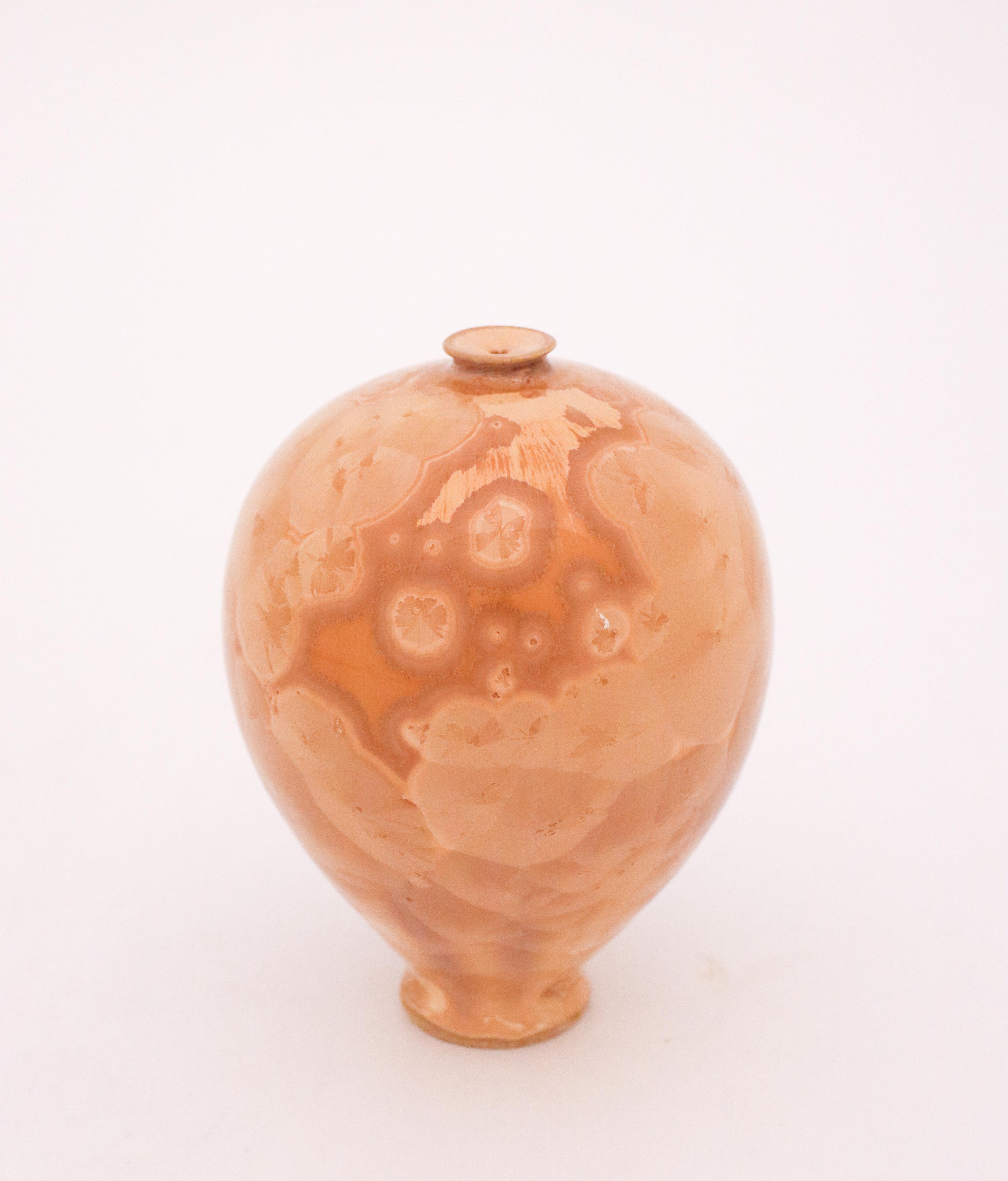 A unique vase with a beige crystalline glaze designed by the contemporary Swedish artist Isak Isaksson in his own studio. The vase is 13 cm (5,2