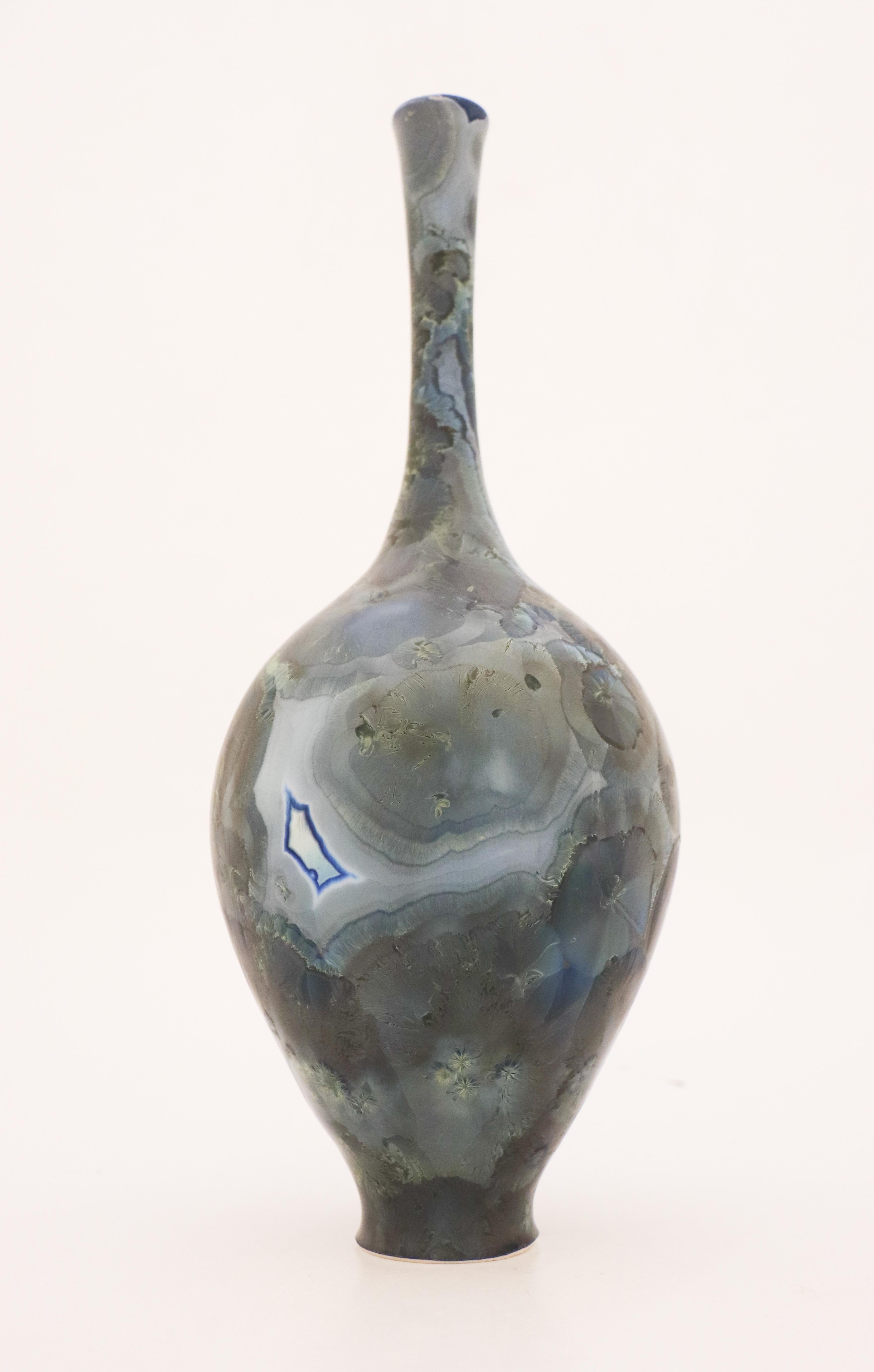 A unique vase in a Dark Green/Blue-tone with a lovely crystalline glaze created by the contemporary Swedish artist Isak Isaksson in his own studio. The vase is 34 cm (13.6