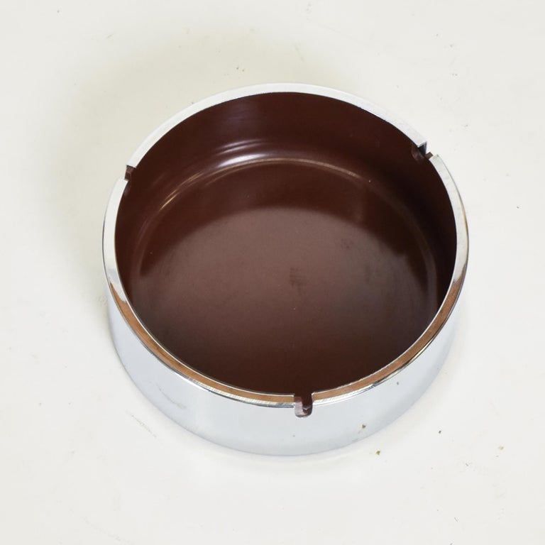 Mid-Century Modern Isamu Kenmochi ashtray in chrome and plastic.
Stamped underneath with makers information. Made in the USA.
Dimensions: 6 in diameter x 2.25 inches tall.
Original preowned vintage condition. Refer to images please.

 
 