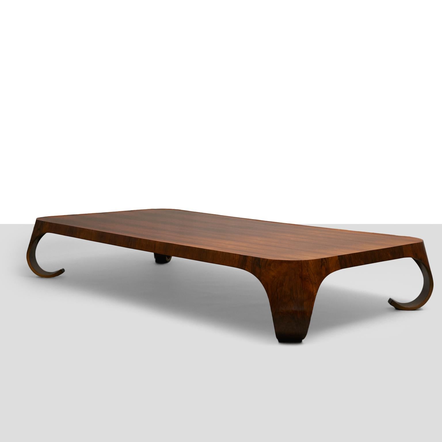 A rosewood coffee table by Isamu Kenmochi. This piece is longer and lower than standard models. Manufactured by Tendo Mokko.
Literature: Japanese Modern, Mori, pg. 143.