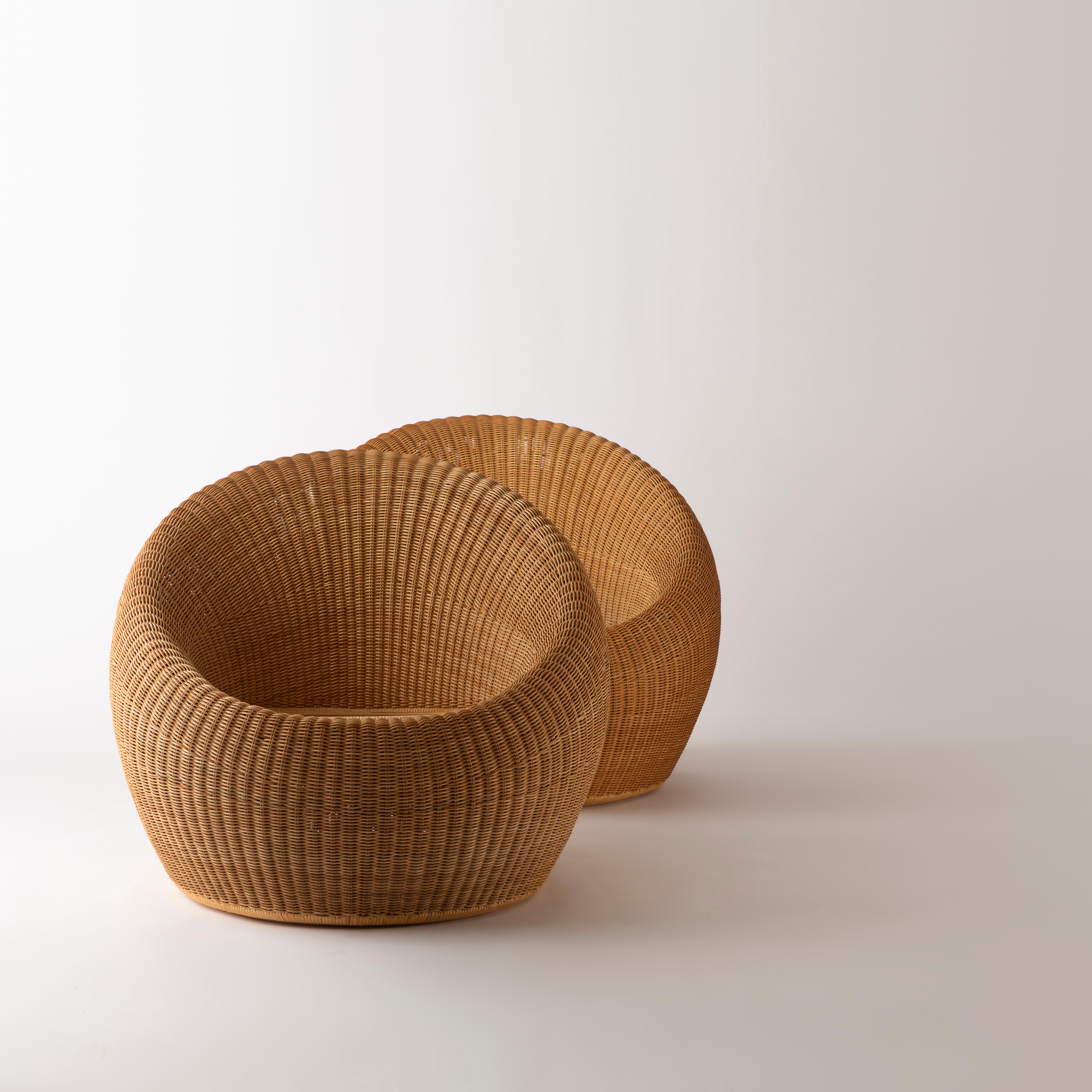 A pair of easy chairs model « C-3150 » from the « Rattan Furnitures » series by the Japanese designer Isamu Kenmochi, in rattan on bamboo, manufactured by Yamakawa Rattan, Japan, model designed in 1960.