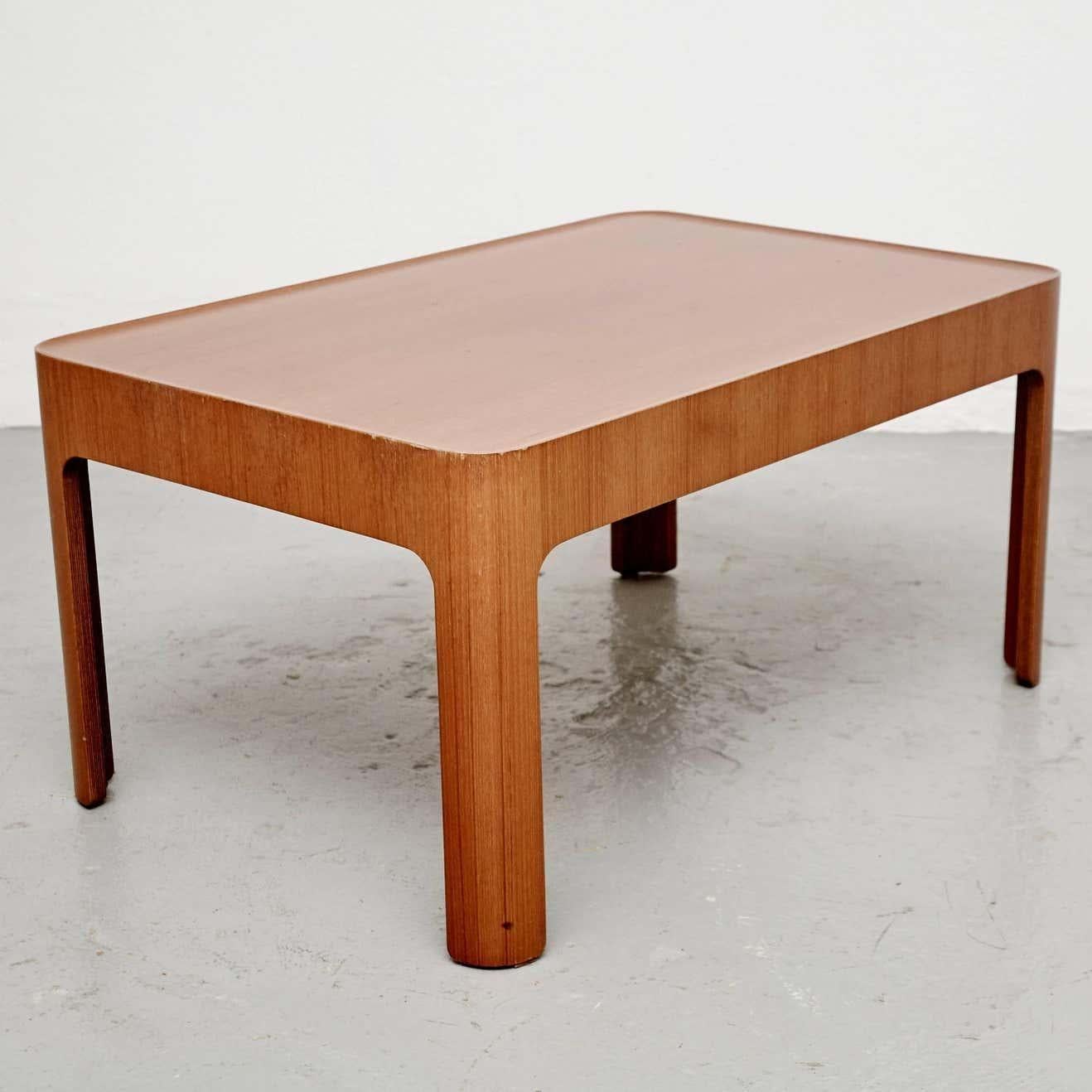 Introduce a touch of Japanese Mid-Century Modern design to your home with this stunning Isamu Kenmochi coffee table. The sleek and Minimalist design is perfect for adding a touch of elegance to your living space, while the warm wood tones provide a