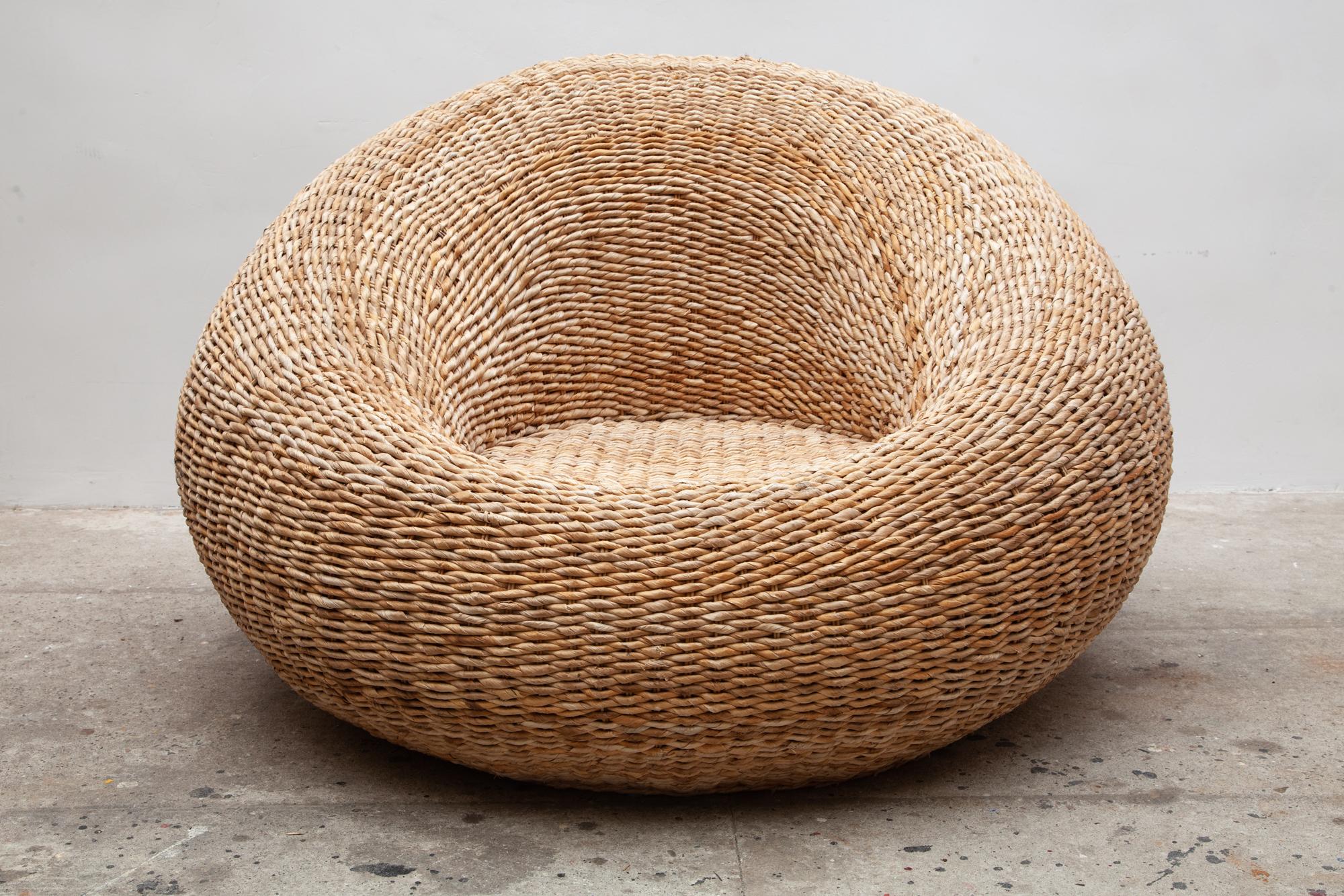 Pair of sculptural woven cord bamboo over-scale club lounge chairs in the style of Isamu Kenmochi .
Vintage circular rattan lounge chairs large structural shape very comfortable seat. Rattan is in great condition for its age.
Dimension: 120 W x 85