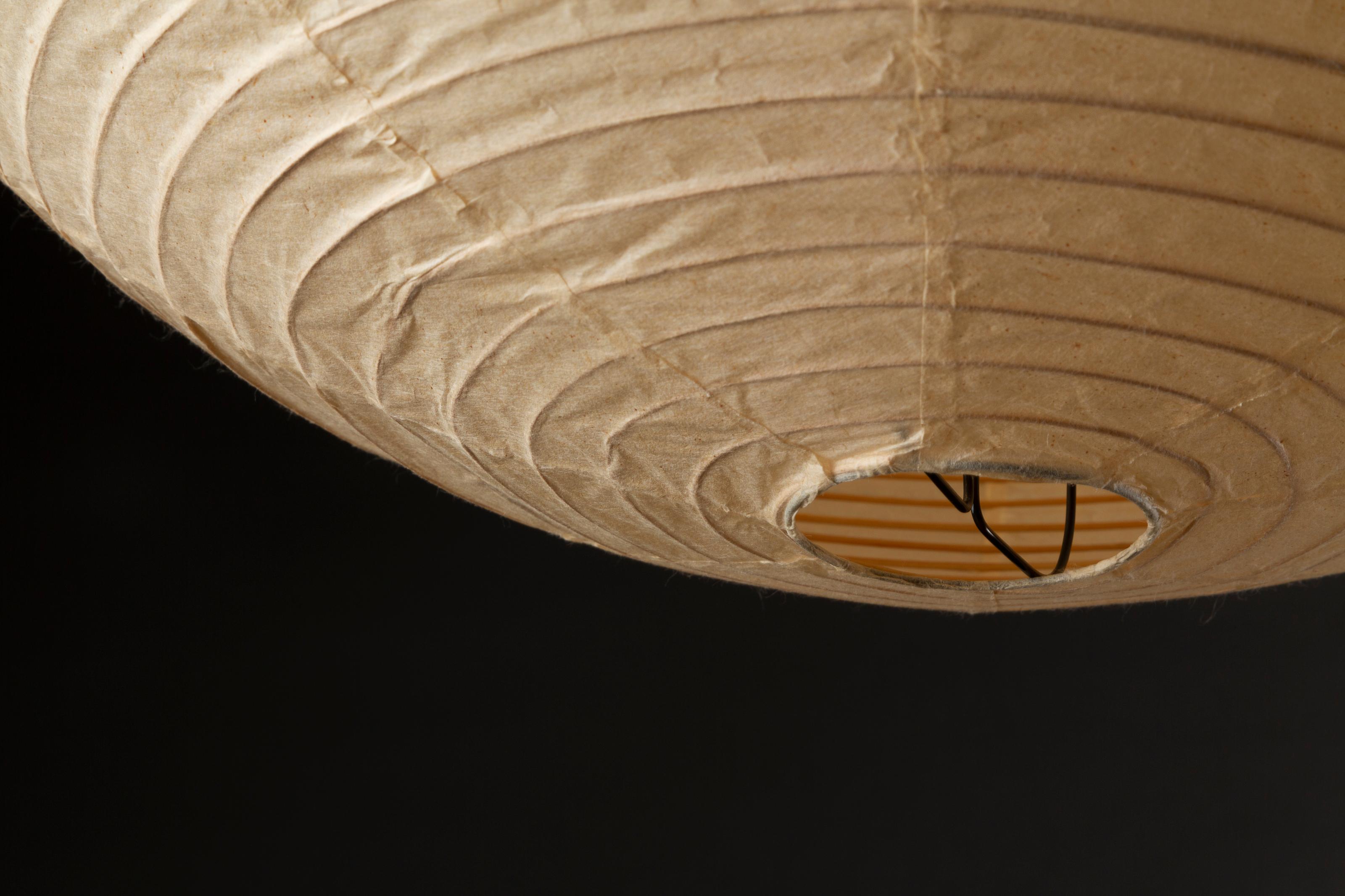 Akari model “55A” by Isamu Noguchi
Original shade in washi & bamboo rims
Structure in black lacquered metal & pebble base in cast iron and bamboo stem
Hand-made form realized by Ozeki Company, Gifu, Japan
Series started in 1951
Early model with