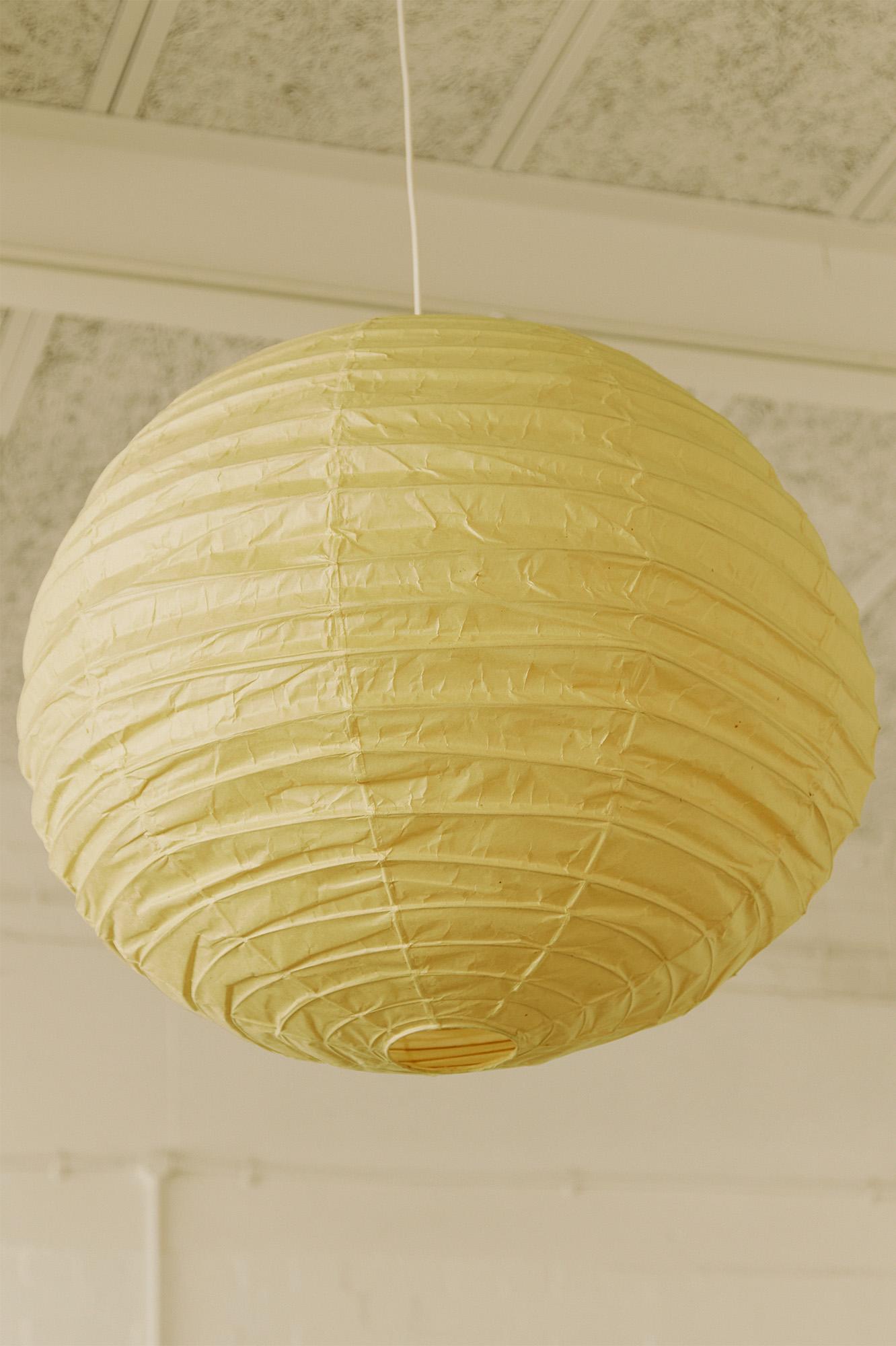 Discover the timeless allure of the Isamu Noguchi Akari Lamp, model 75D, a pendant lamp/light sculpture designed around 1950 and manufactured by Ozeki & Co. Ltd. in Japan. This mid-century modern masterpiece features a bamboo ribbing structure