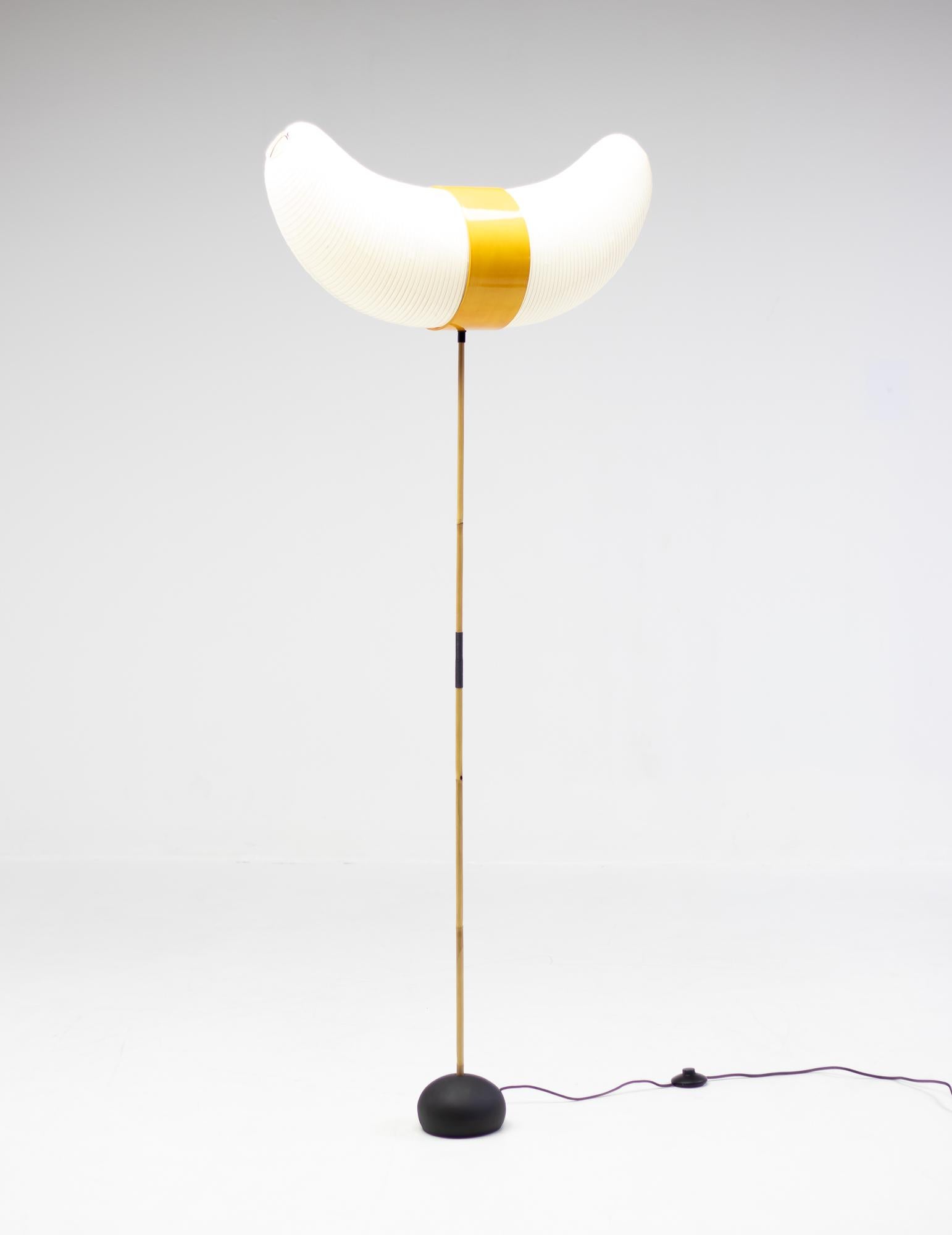 Poetic Isamu Noguchi Akari floor lamp, model BB3-33S. 
Cast iron base with bamboo stem and a handmade washi paper shade. 

Akari Light Sculptures by Isamu Noguchi are considered icons of 1950s modern design. 
Designed by Noguchi beginning in
