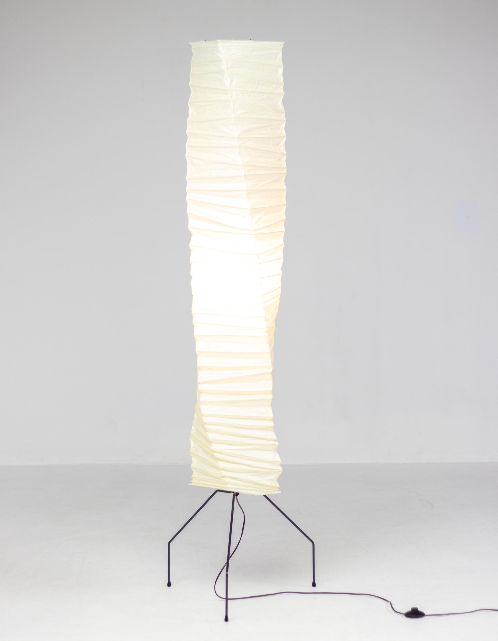 Poetic Isamu Noguchi Akari floor lamp, model UF4-J1. 
The light sculpture is created from handmade washi paper and bamboo ribbing, supported by a metal frame.

Akari Light Sculptures by Isamu Noguchi are considered icons of 1950s modern design.