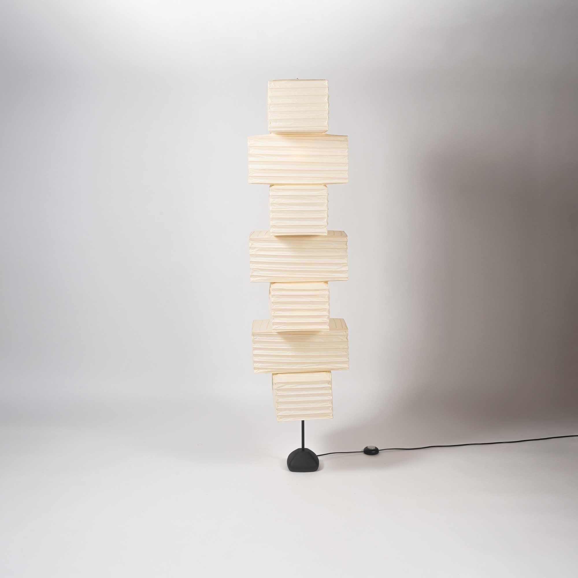 Rare and unusual New old stock Isamu Noguchi Akari floor lamp model ST2-36N, Isamu Noguchi stamped on steel base and shade. In pristine condition no scratches on the frame or tears on the shade.