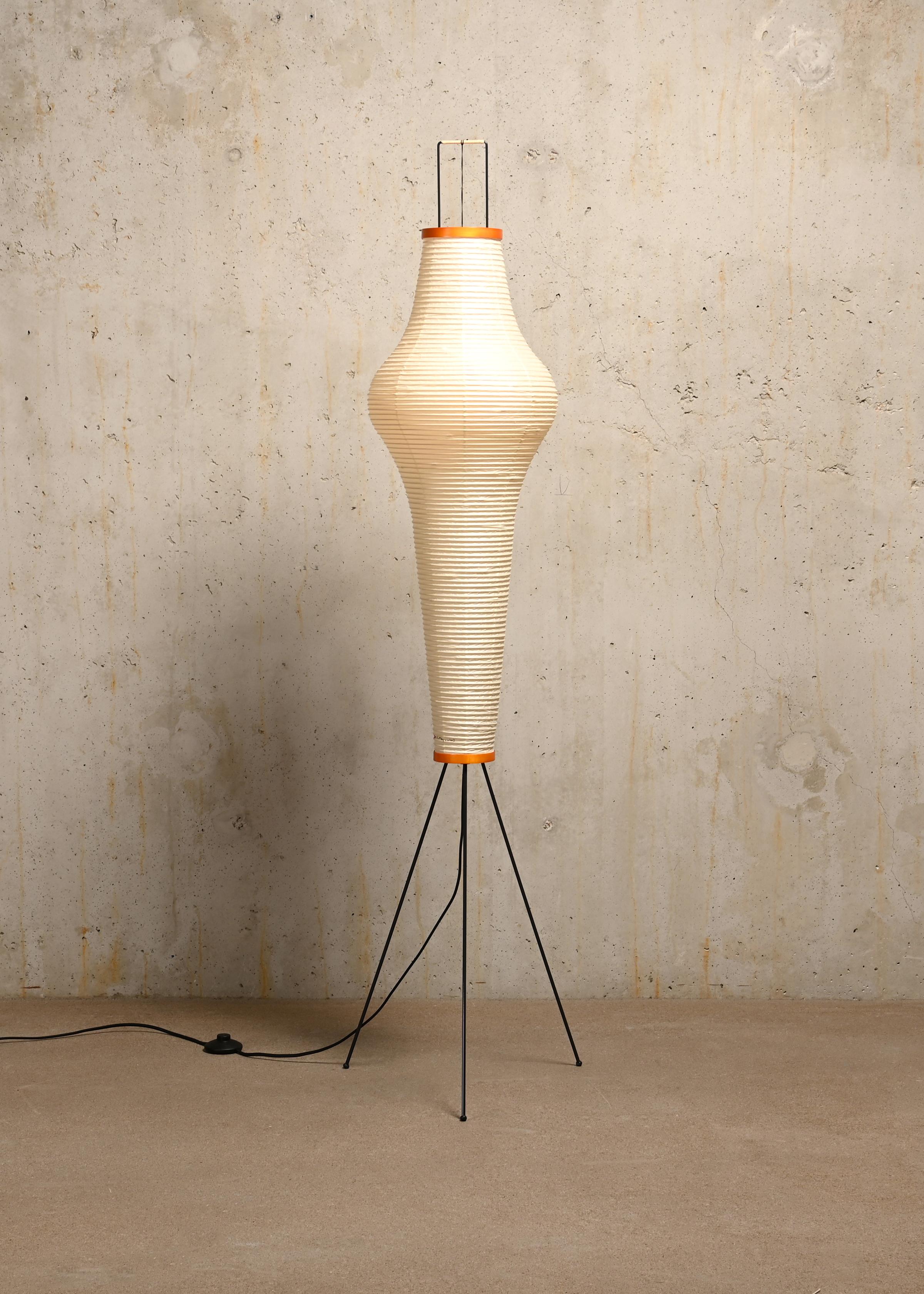 Akari light sculpture (Model 14A) by Isamu Noguchi handcrafted from traditional washi paper and bamboo. Each Akari Light Sculpture was meticulously crafted by hand in the Ozeki workshop, a traditional family-run company based in Gifu, Japan. 
The