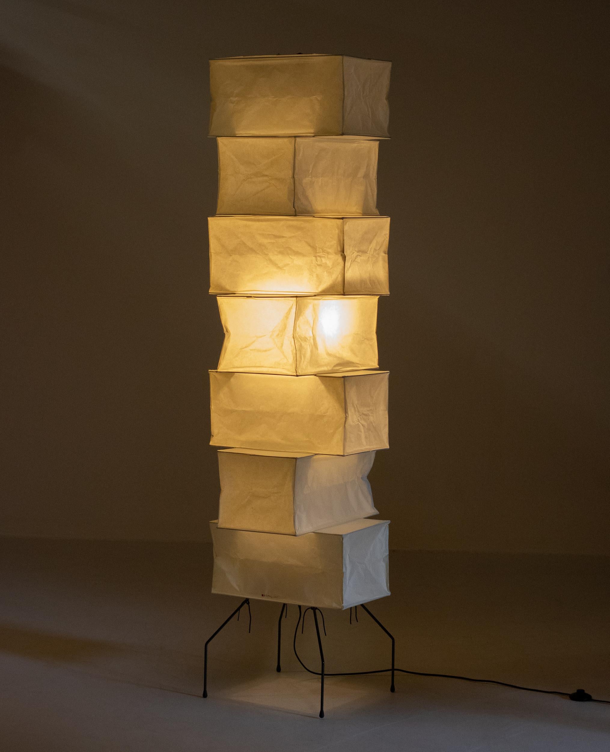 Akari UF4-L10 floor lamp designed by Isamu Noguchi, 1951. Manufactured by Ozeki & Co. in Japan. 
Bambu structure covered by washi paper supported by a coated metal base. Recent production, wired for U.S. standards. This fixture has one socket. We