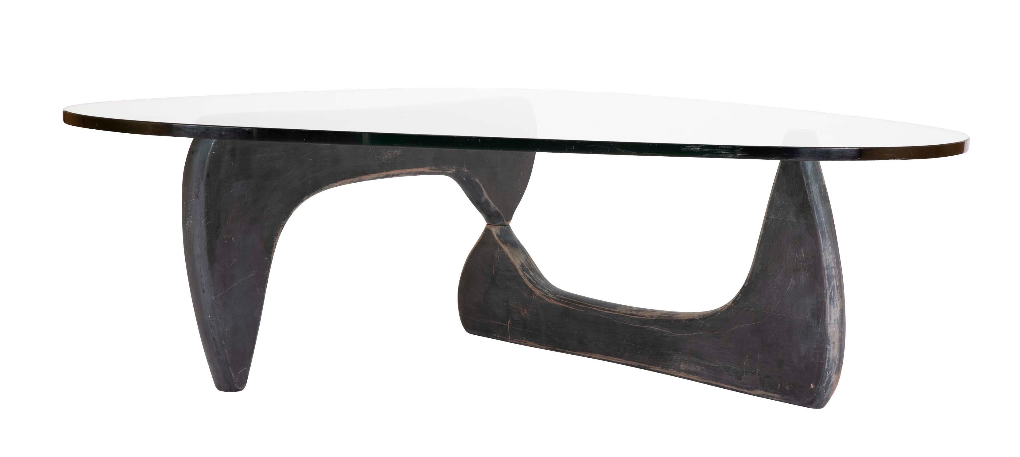 Iconic Isamu Noguchi Herman Miller coffee table with glass top and wood base. The biomorphic form became the epitome of Mid-Century Modern design. I remember even as a child being impressed by our neighbors Noguchi table, and coveting it!
In 