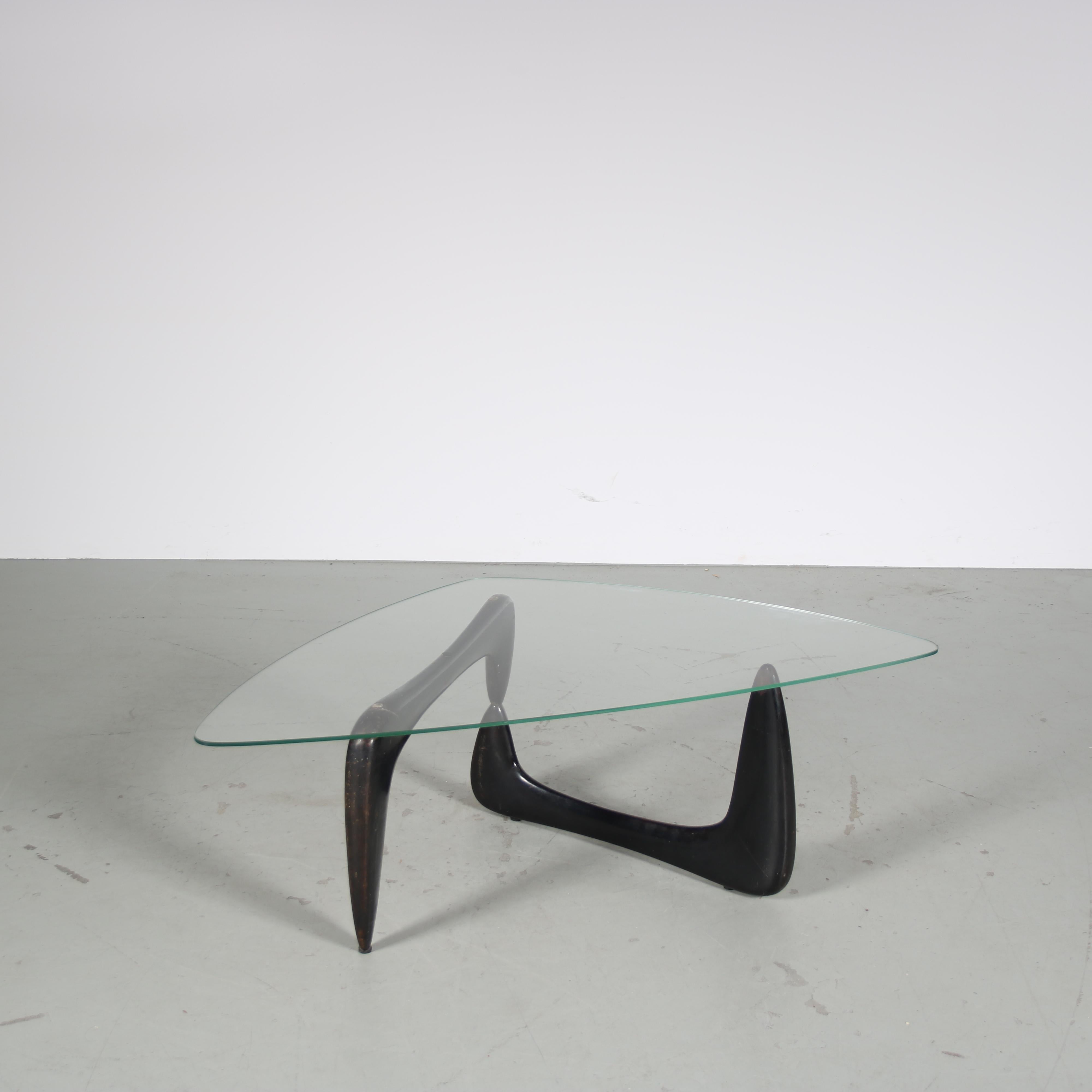

An iconic coffee table designed by Isamu Noguchi, manufactured by Knoll International in the USA around 1950.

This eye-catching piece has a black wooden base in beautiful shape. The two similar shaped elements of the base combine nicely into a