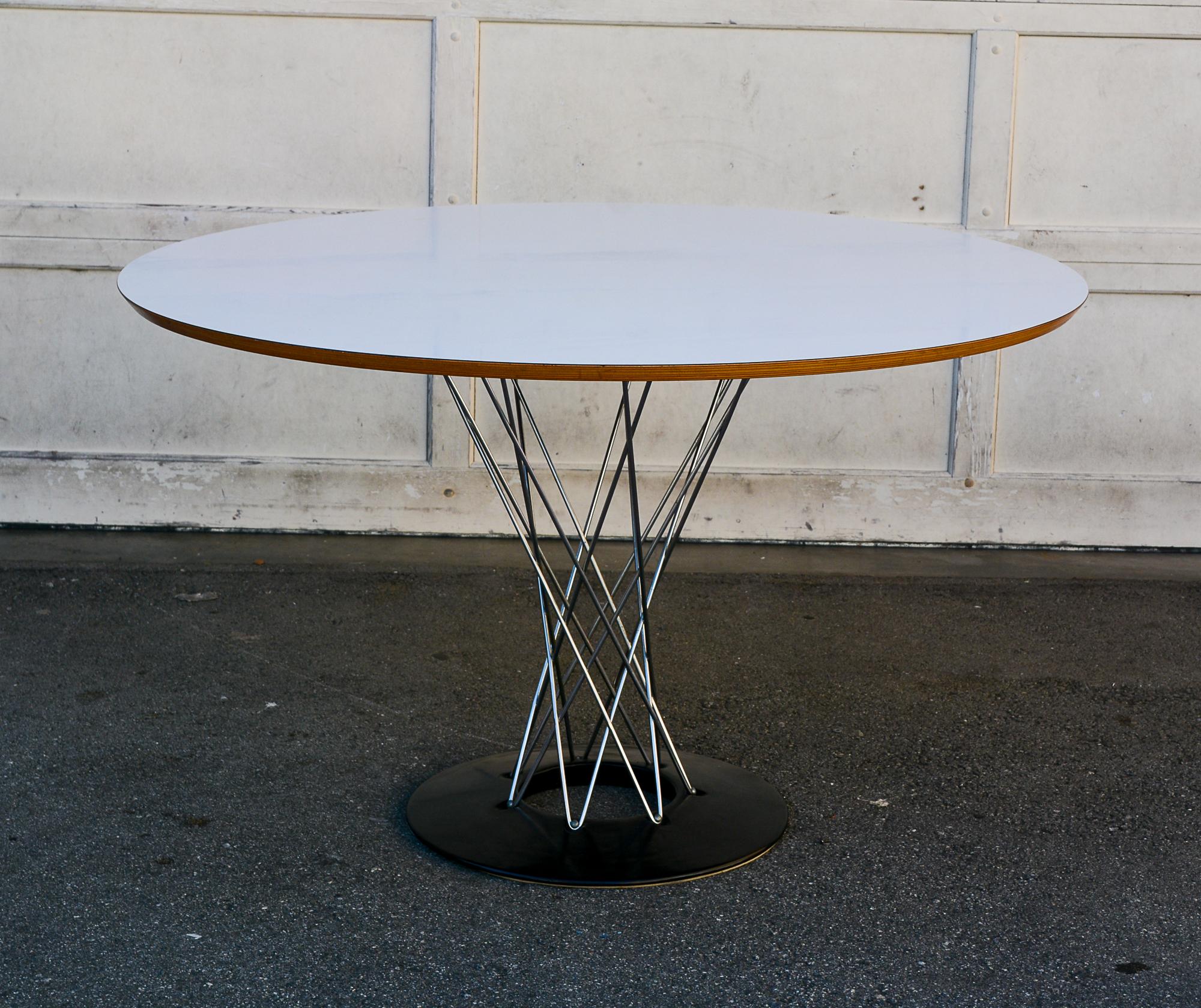 Cyclone dining table designed by Isamu Noguchi and manufactured by Knoll. This table dates to the 1960's. This was the largest size made at just under 48 inches diameter. This size in not in currently in production. The table has a white laminate
