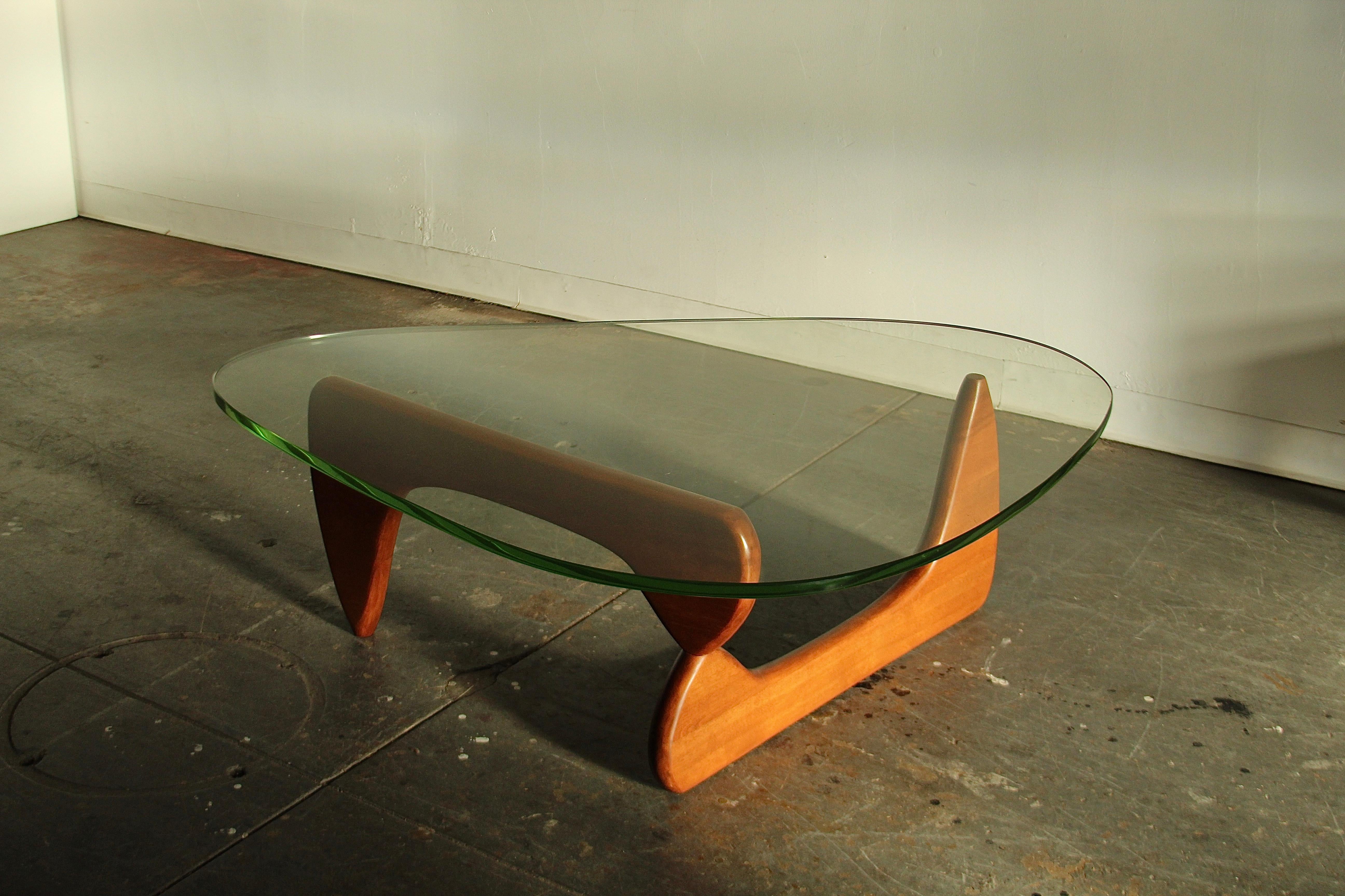 A stunning and completely original Isamu Noguchi's IN-50 coffee table circa ~1949. This example consists of an early cherry wood base and the original apple green glass. The cherry base has been gently refinished and waxed and is in phenomenal