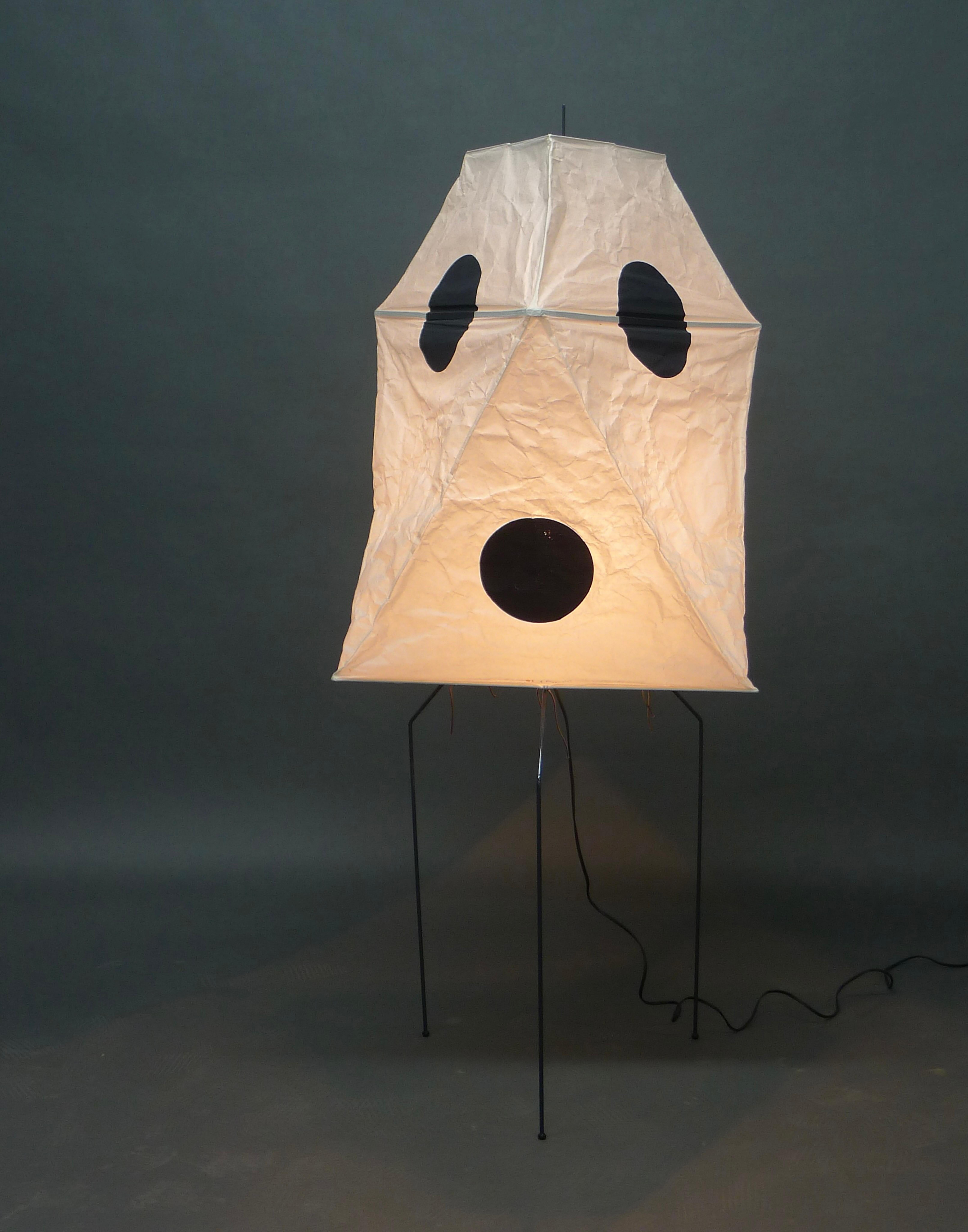 An Akari light sculpture, model UF3-Q, designed by Isamu Noguchi in 1951, and manufactured by Ozeki & Co. in Gifu, Japan.  

Comprising a coated metal folding tripod base, with removable washi paper shade, the six sides given structure by internal