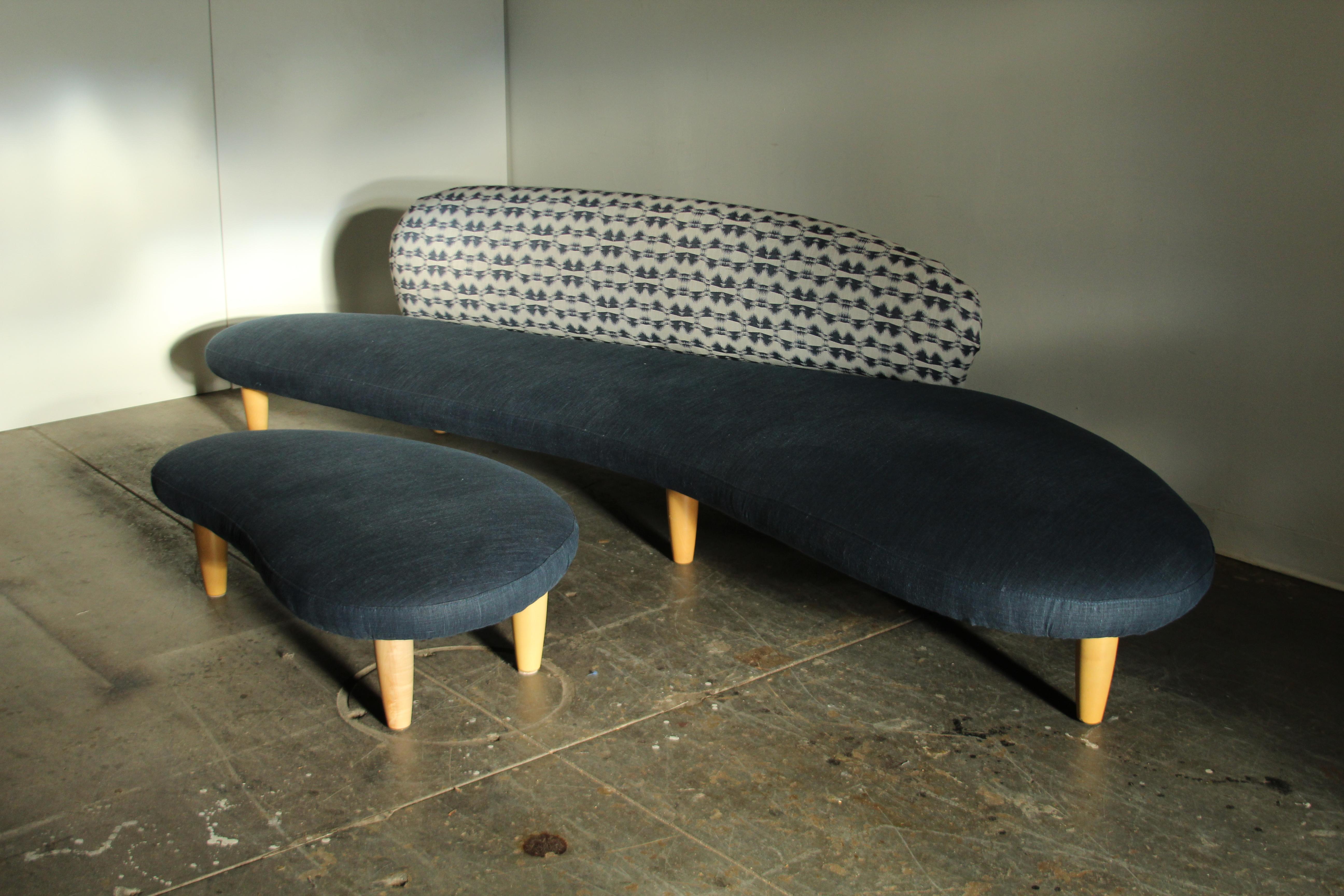 A sublime Freeform sofa by Isamu Noguchi, produced by Vitra circa 2002. This is a very early production example: the 33rd piece produced, to be exact. This long, low, and organic sofa has been newly reupholstered. The seat of the sofa is covered in