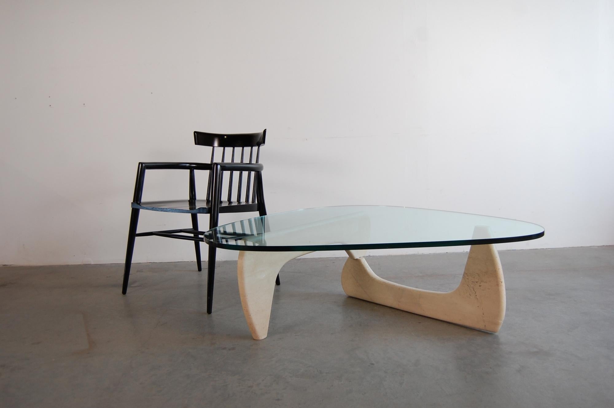 IN-50 style coffee table, in the style of Isamu Noguchi, circa 1948. This particular tables base is in travertine marble, which is seldom seen, and was most likely produced in the late 1960s or early 1970s. Measures: 49