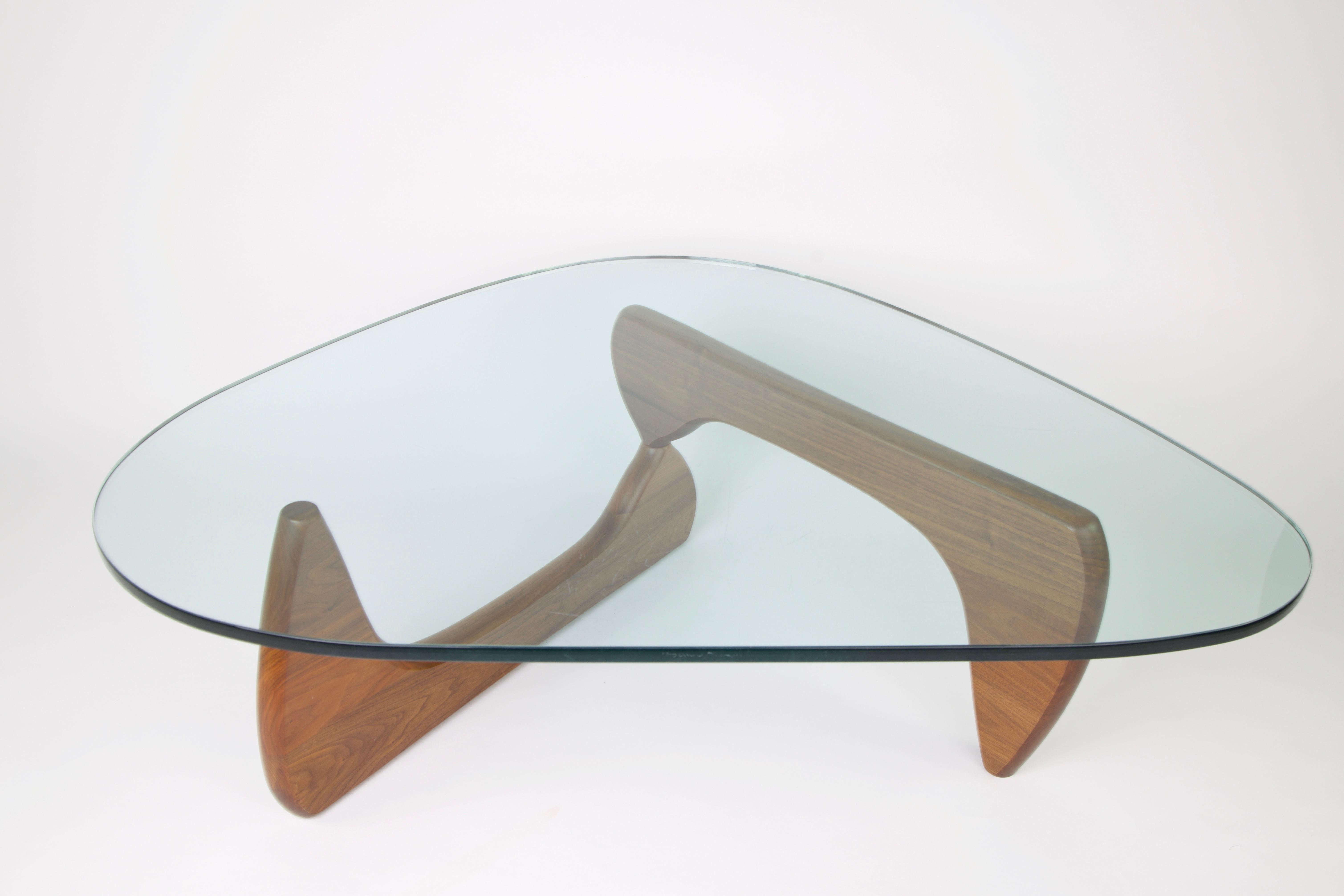 The glass has Isamu Noguchi's signature and the base has a Herman Miller tag.

The Noguchi table is a piece of modernist furniture first produced in the mid-20th century. Introduced by Herman Miller in 1947, it was designed in the United States by