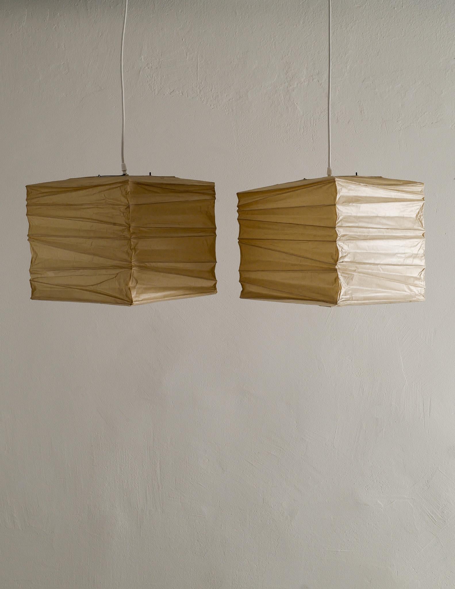 Rare trio of all original washi paper and bamboo pendants designed by Isamu Noguchi in 1971 and produced by Ozeki & Co., Ltd in the early 1970s. Two 