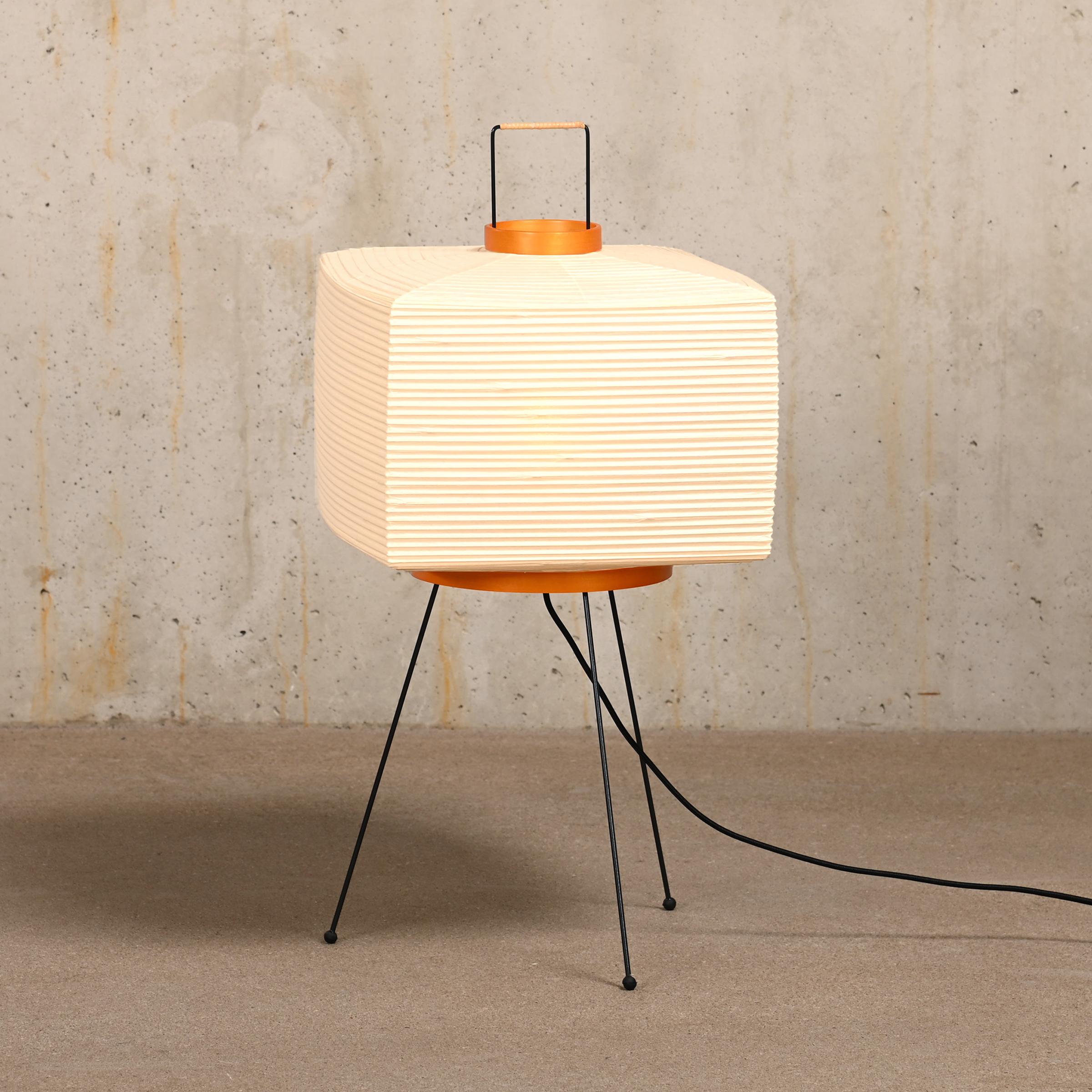 Iconic Akari light sculpture known as Model 7A designed by Isamu Noguchi and handcrafted from traditional washi paper and bamboo. Each Akari lamp shade is meticulously crafted by hand in the Ozeki workshop, a traditional family-owned company, based