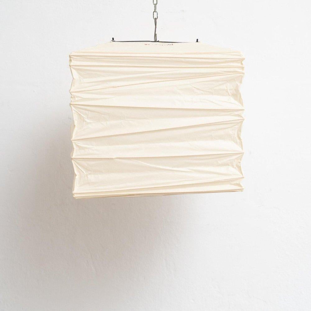 Illuminate your space with the timeless elegance of the Isamu Noguchi Pendant Lamp Model 33X. Designed by the acclaimed sculptor Isamu Noguchi and manufactured by Ozeki 
Company Ltd. in Japan, this pendant lamp showcases a bamboo ribbing