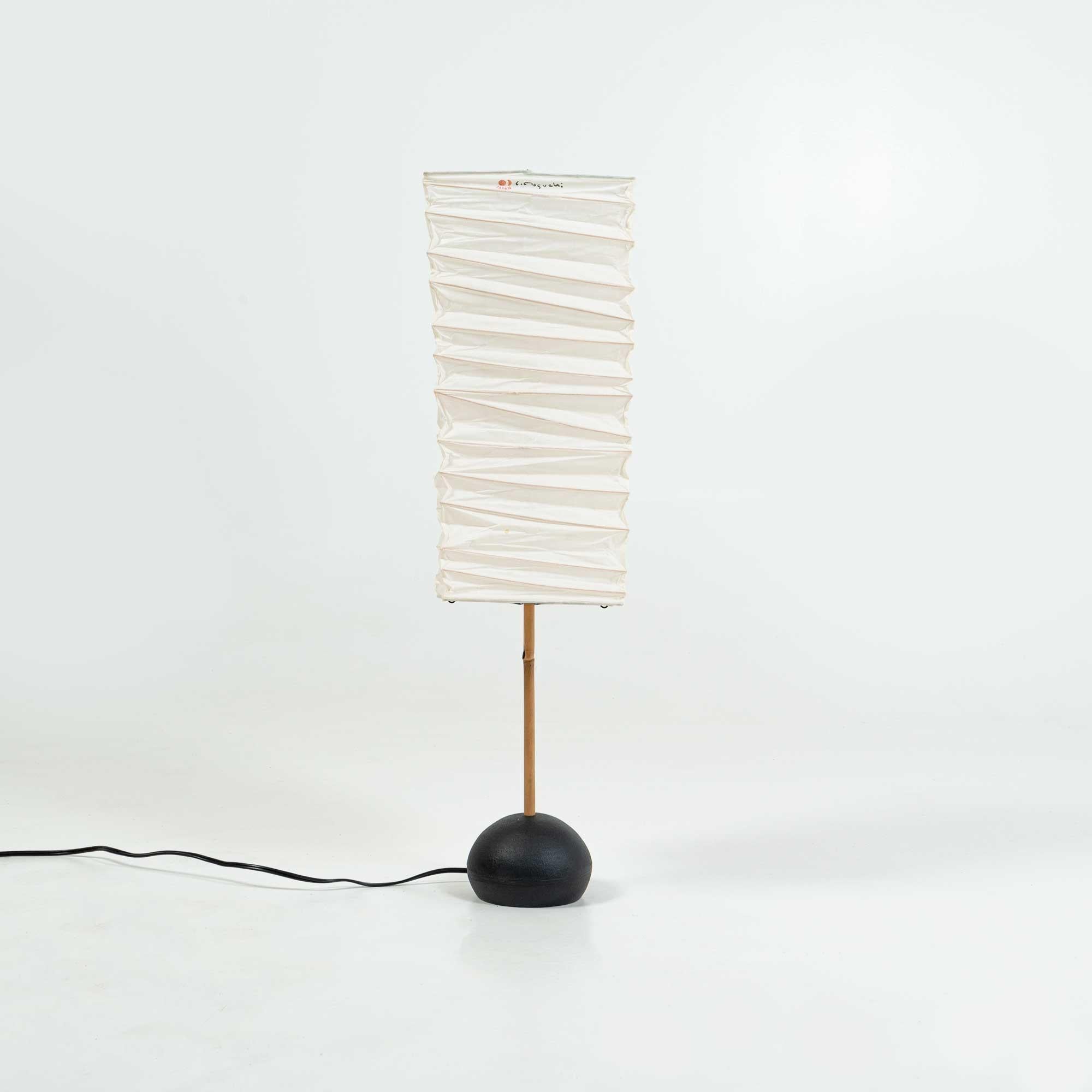 A 1990s production of the Isamu Noguchi Table Lamp, BB2 base with 45XN shade. Overall in great condition, some light discoloration on the shade, some patina on the metal base. wired 110v. Ready for use.