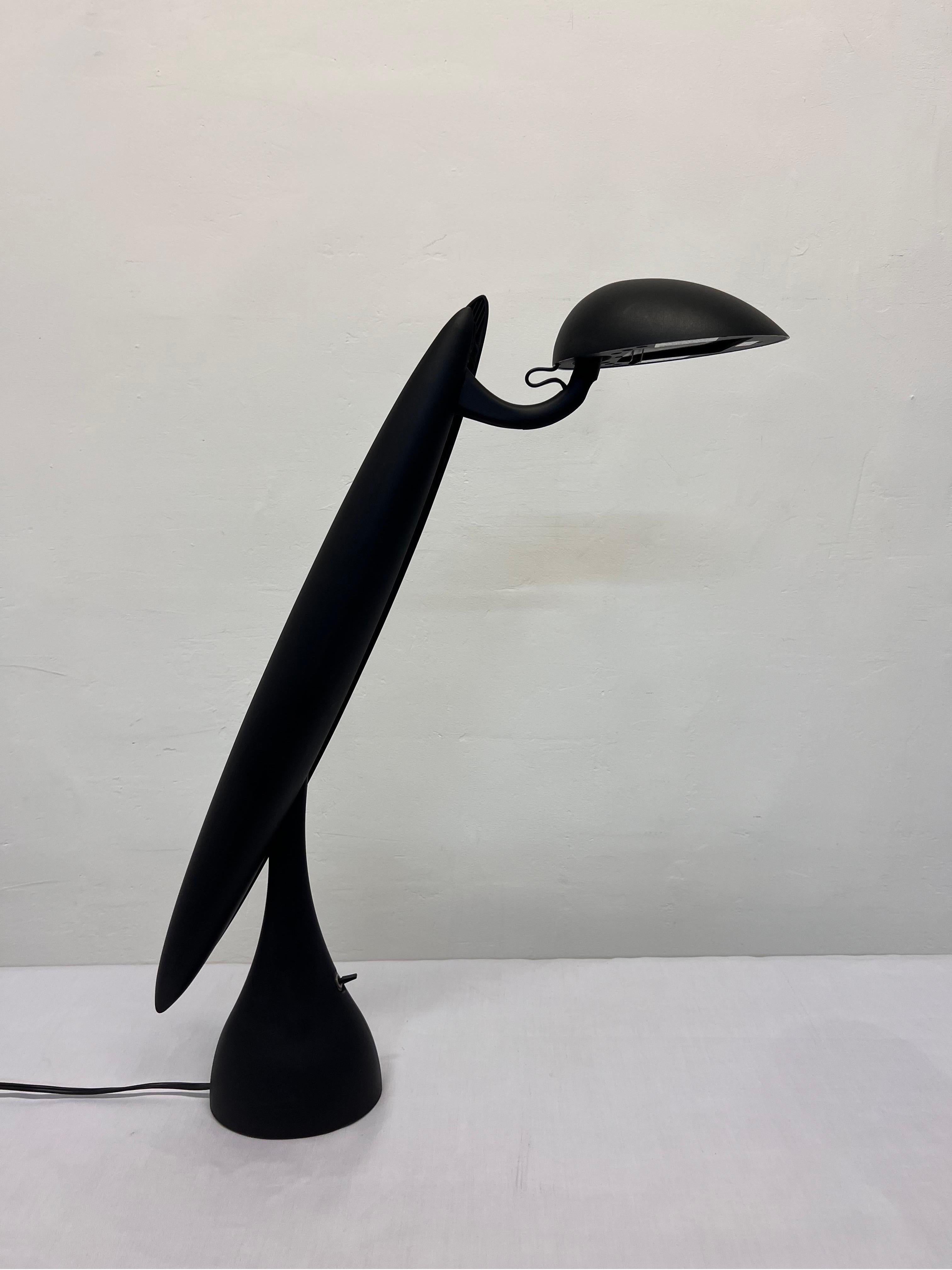 Heron lamp rendered in a black plastic shell over steel inner frame by Isao Hosoe for Luxo Norway, 1990s. The Heron contains a mechanism that always keeps its head (the hood) parallel to the desk surface while also being adjustable side to side and