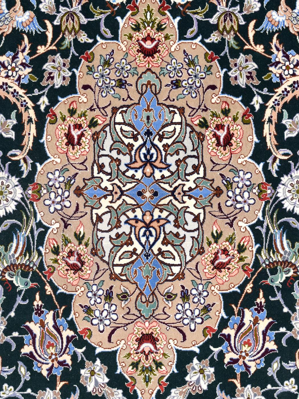 Welcome this blue, cream, and red 5' x 7' Persian Isfahan carpet into your home, handknotted in wool and silk. The intricate patterns and meticulous craftsmanship of this area rug tell a story of tradition and heritage, making it not just a floor