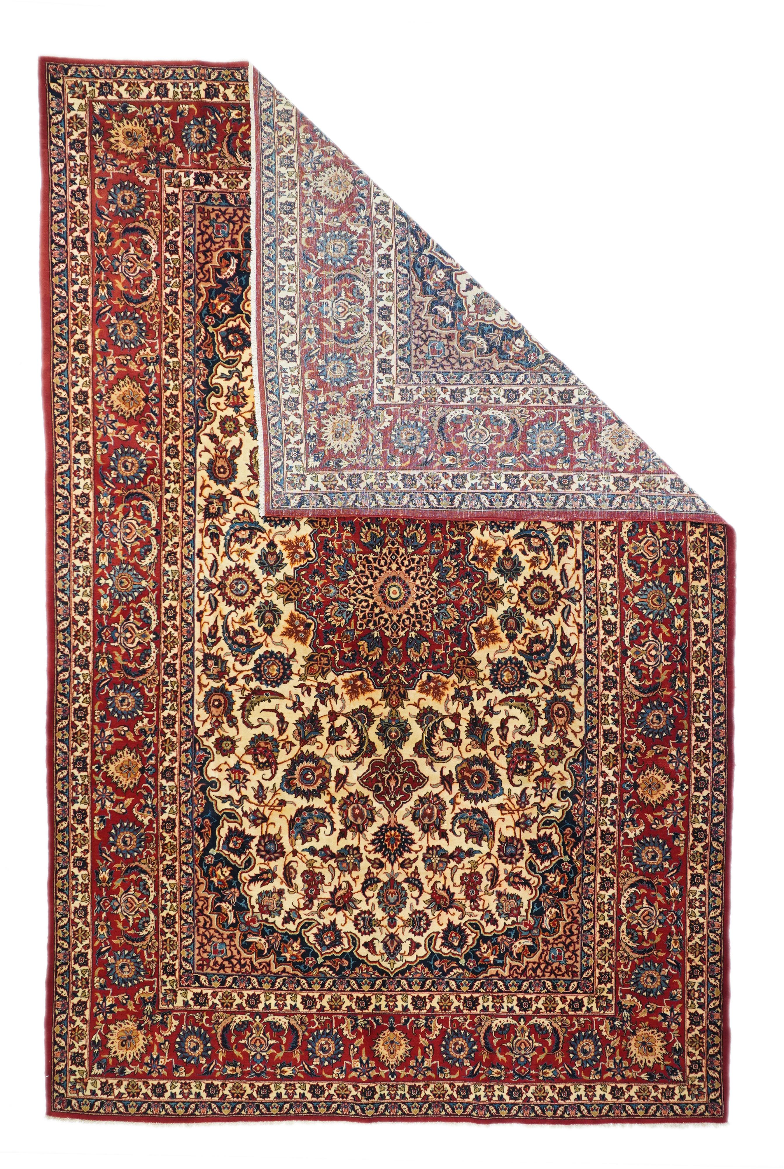 Classically Isfahan revival with an elliptical cream field centered by a red 8-point star medallion, closely supported by vinery and palmettes that shrink towards the field ends. Navy extended corners. red border with paired sickle leaves, oval