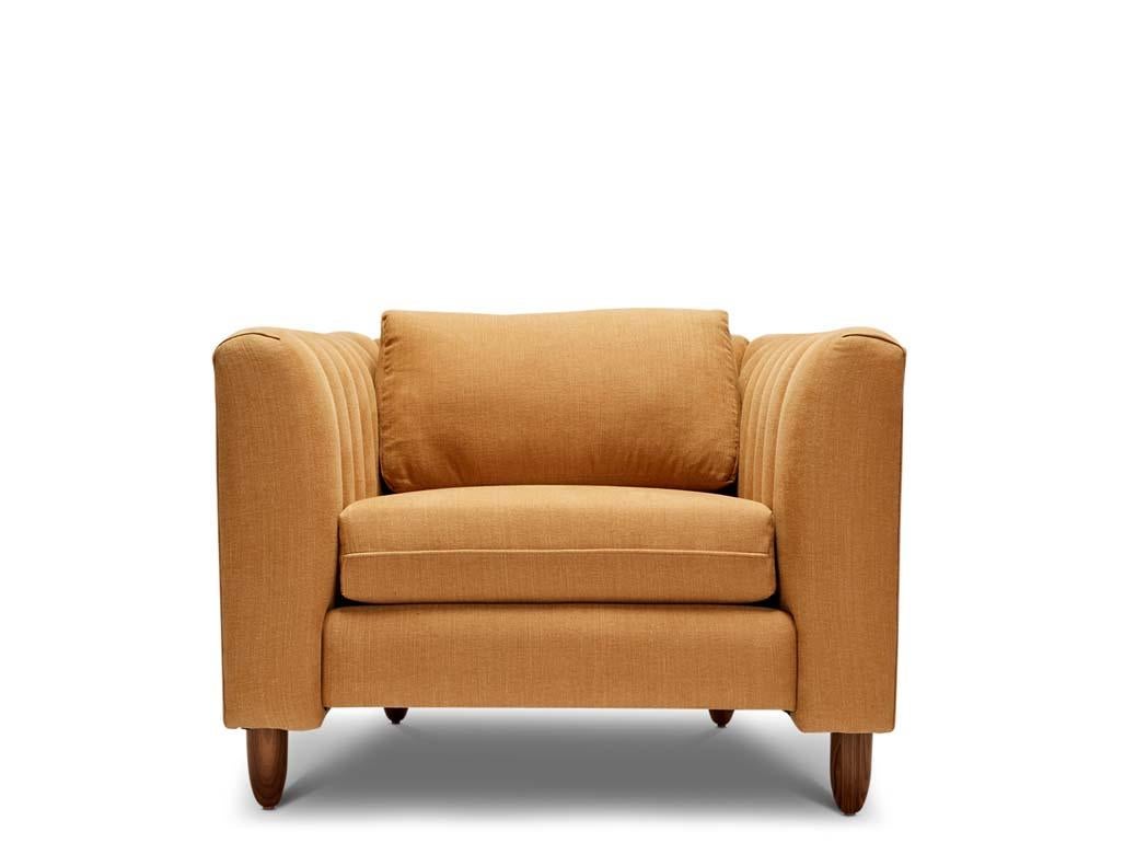The Isherwood chair features a channel tufted body with loose seat and back cushions. The turned legs are made of solid white oak or American walnut and are inset on the sides revealing the leg detail.

The Lawson-Fenning Collection is designed and