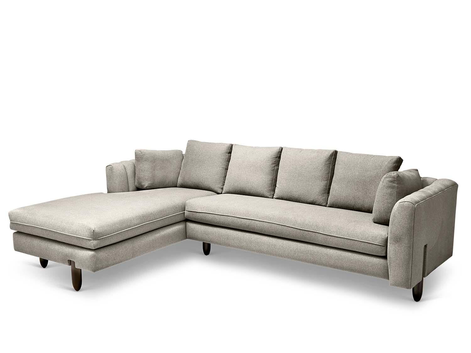 The Isherwood sectional features a channel tufted body with loose bolster cushions. The turned legs are made of solid white oak or American walnut and are inset on the sides revealing the leg detail.

The Lawson-Fenning Collection is designed and