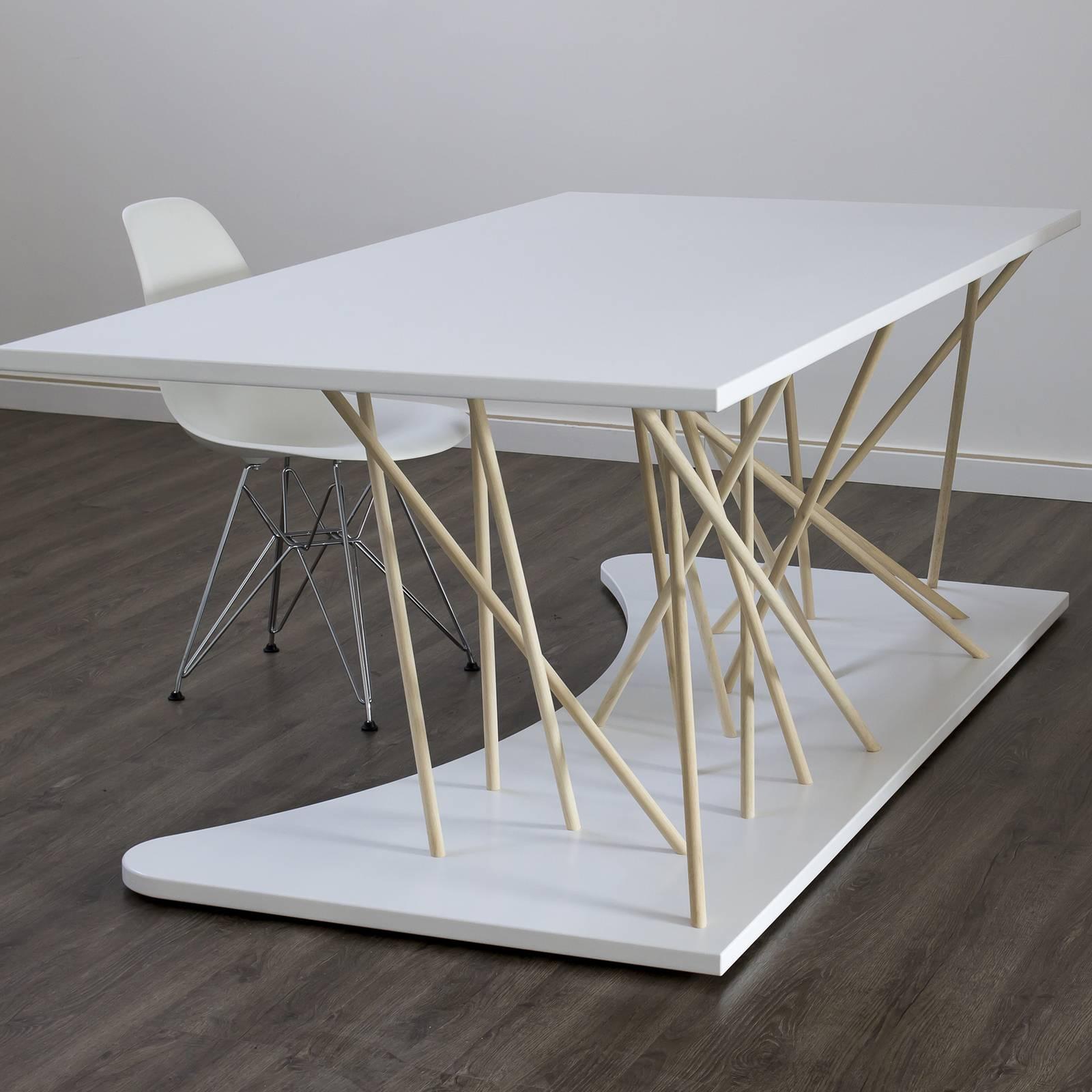 Bold lines and exceptional detailing will make this desk the focal point of any modern-styled office. Handcrafted entirely of solid wood, this piece stands out for its intriguing design achieved by the intersection of natural-finished rods with the