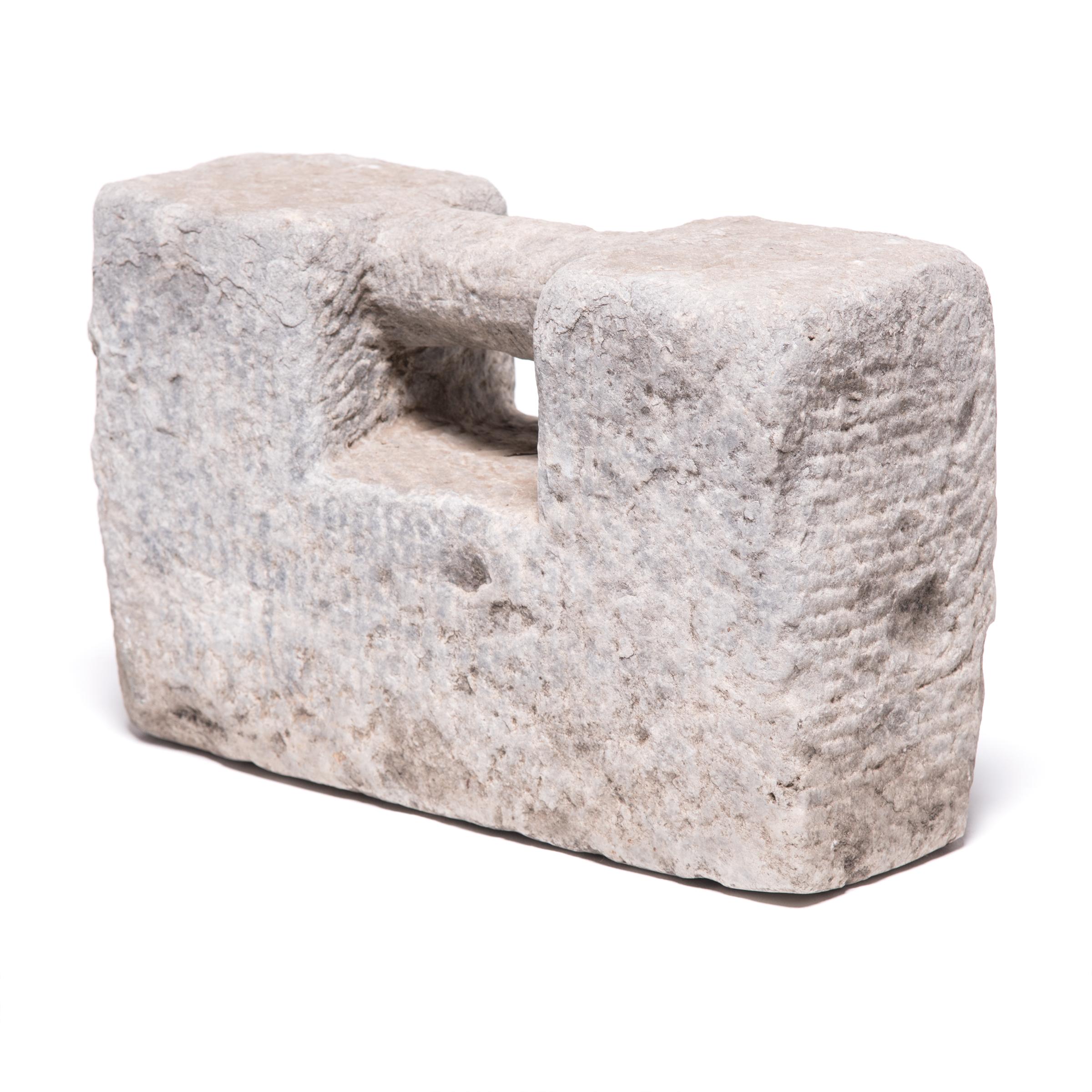 Today known by the Japanese name “ishi-sashi,” meaning “awesome stone padlock,” weights such as this one were once used as part of intensive martial arts training. Shaped like ancient Chinese locks, the weights was carved from limestone and used